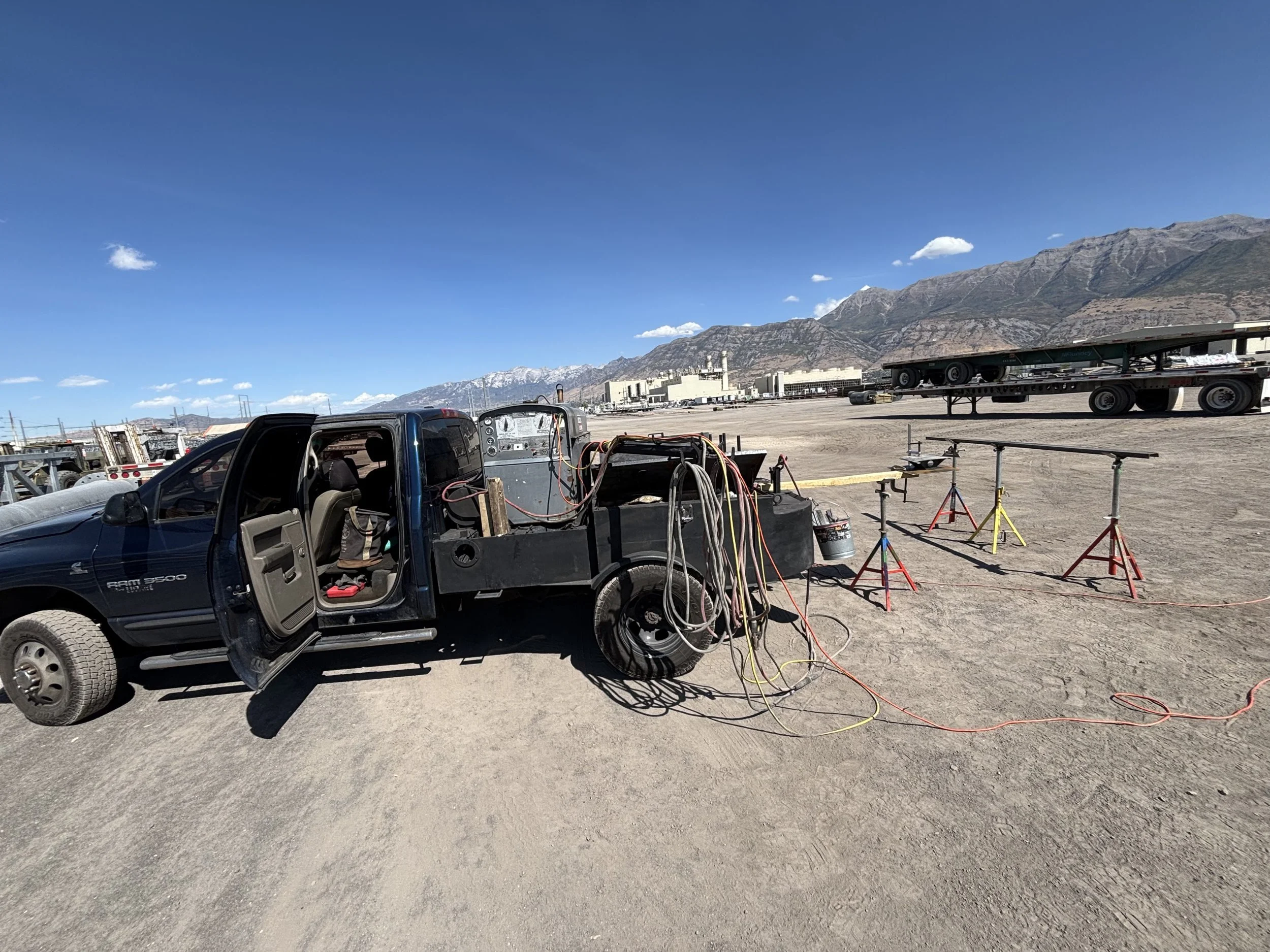 Martin Metal Works mobile welding rig set up at a job site with the Utah mountains in the background