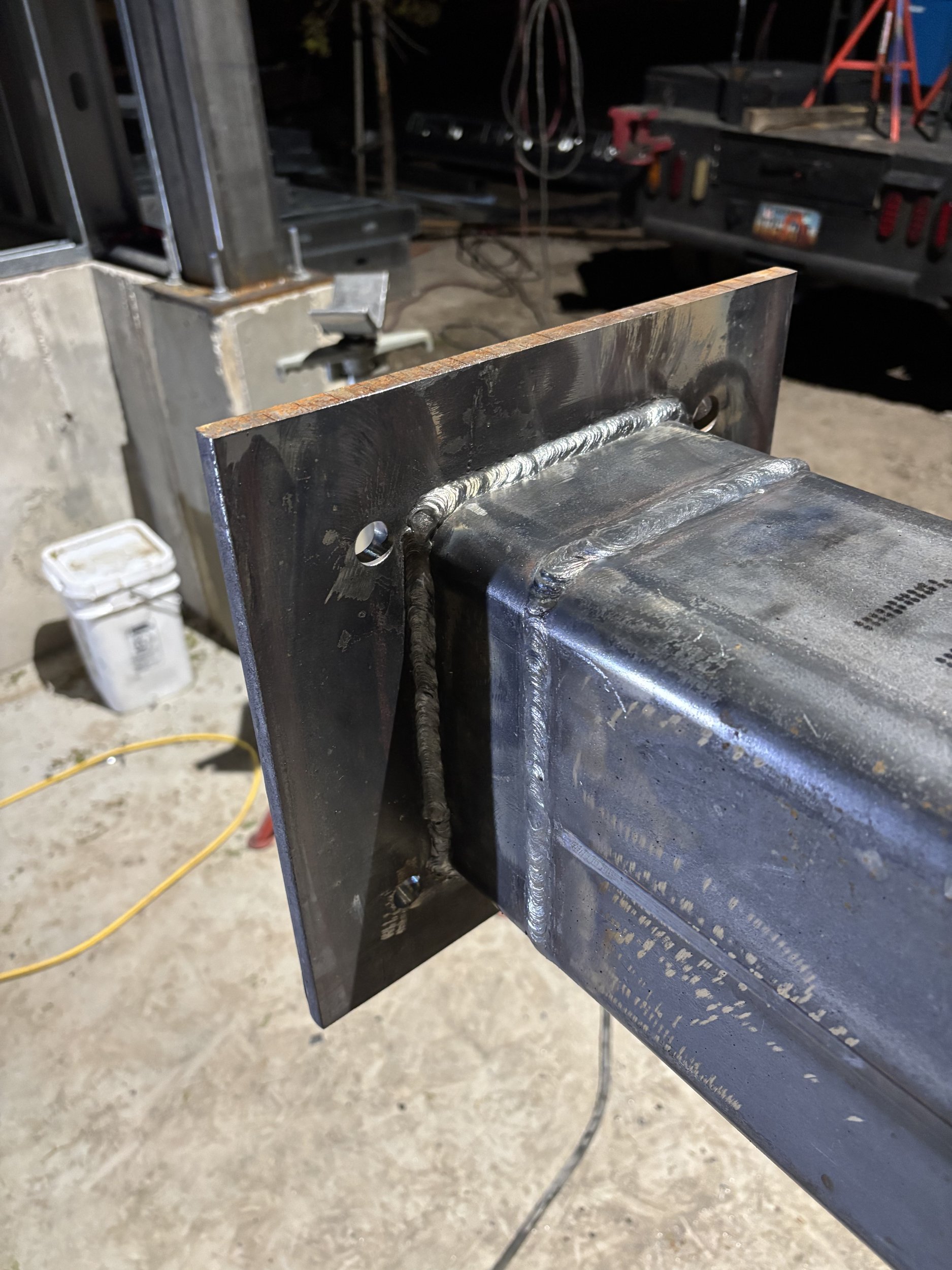 Structural steel column welded to a base plate for a commercial construction project