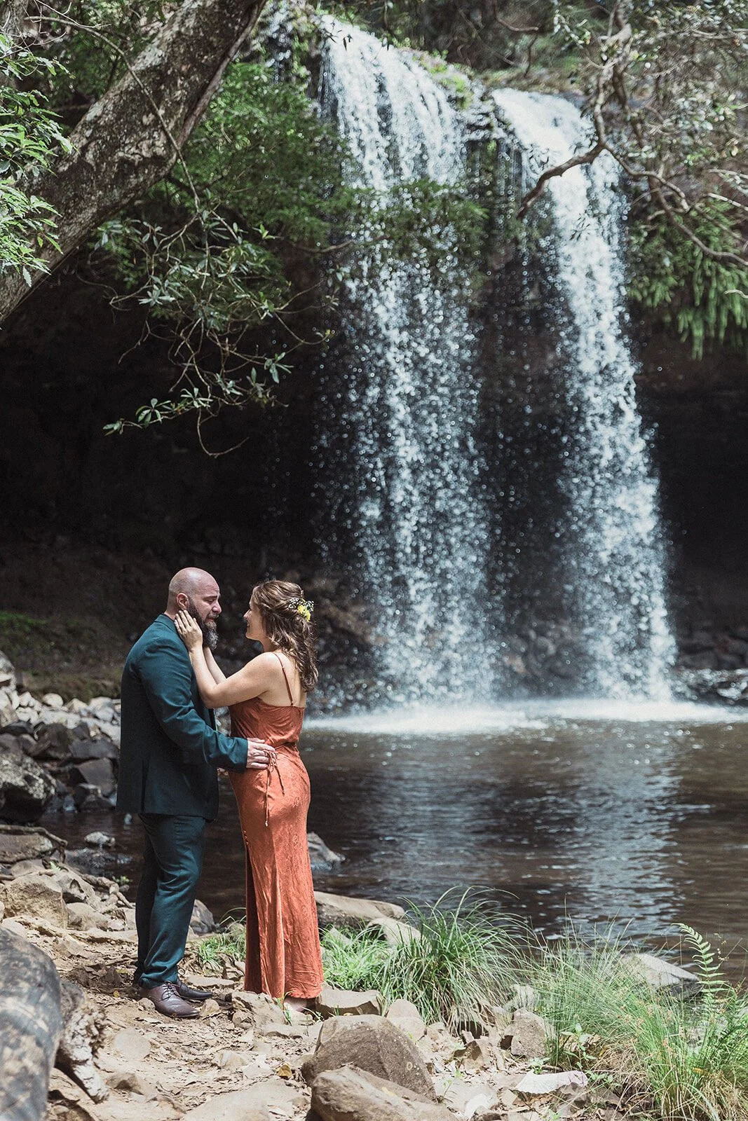 Couple kissing in front of the twin waterfall, Sara and Graeme's elopement at Killen Falls, Northern Rivers