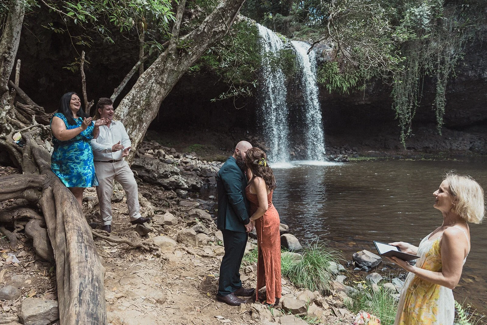 Couple with celebrant and guests at the waterfall, Sara and Graeme's elopement at Killen Falls, Northern Rivers