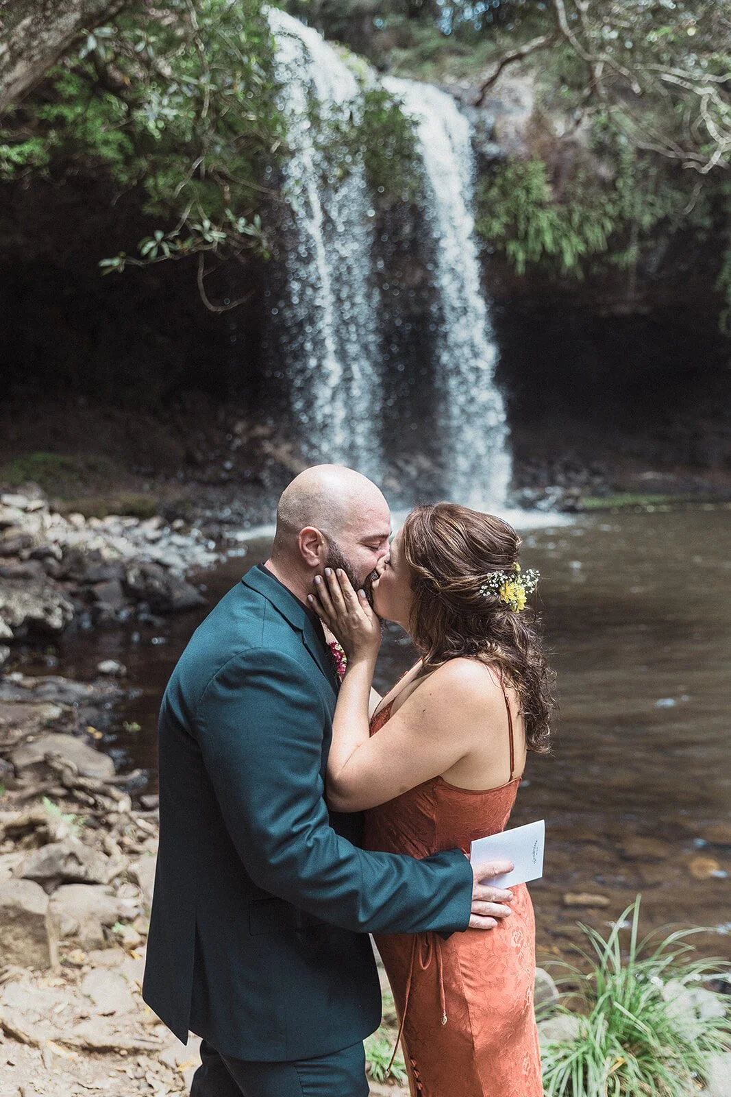 Couple kissing beside the waterfall, Sara and Graeme's elopement at Killen Falls, Northern Rivers