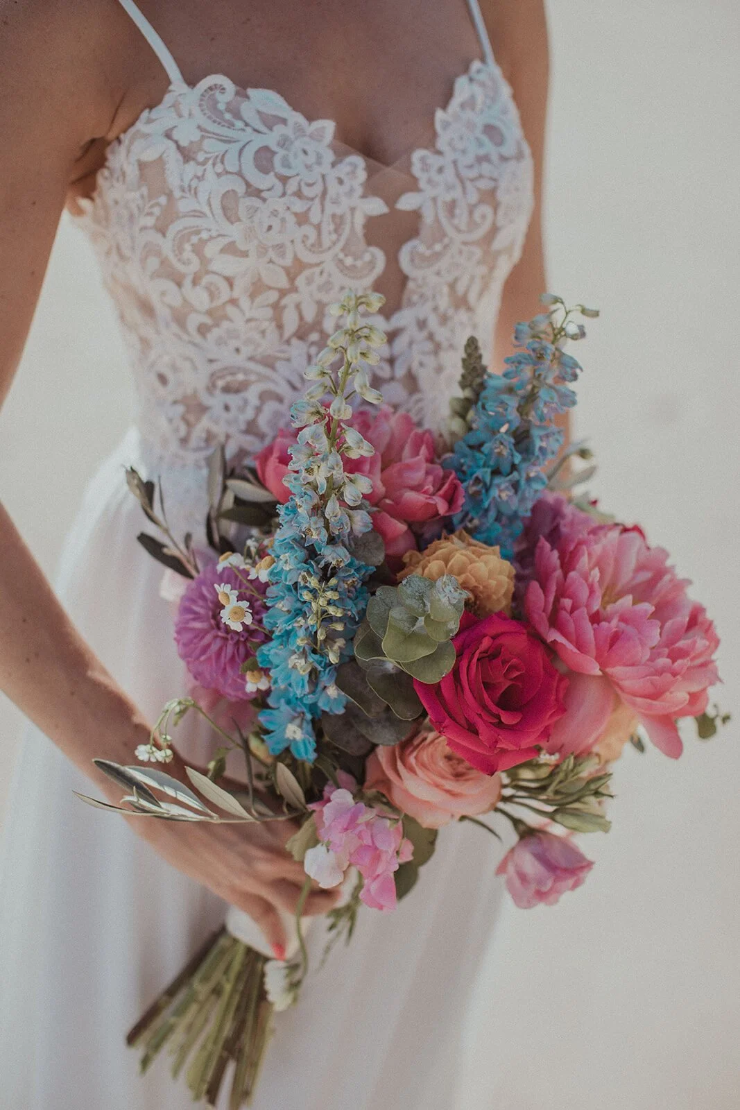 Detail of the lace dress and a bright bouquet, Eliza and Greg's elopement at Broken Head, Byron Bay