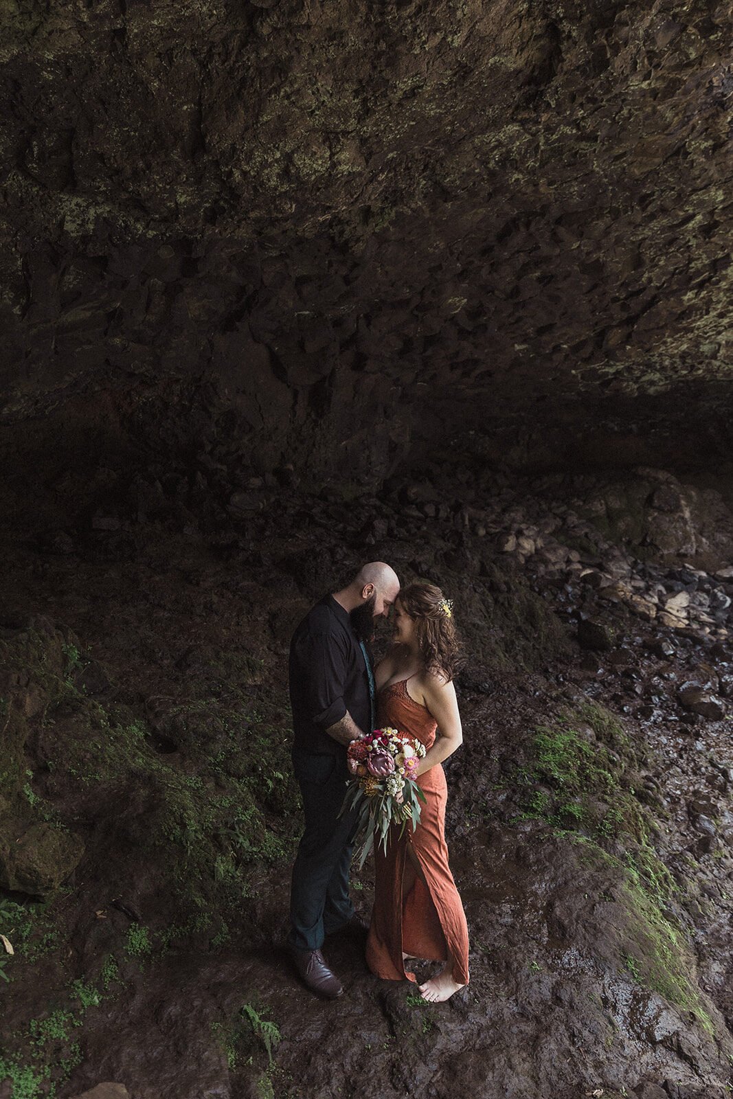 Couple kissing in the cave beneath an overhang, Sara and Graeme's elopement at Killen Falls, Northern Rivers