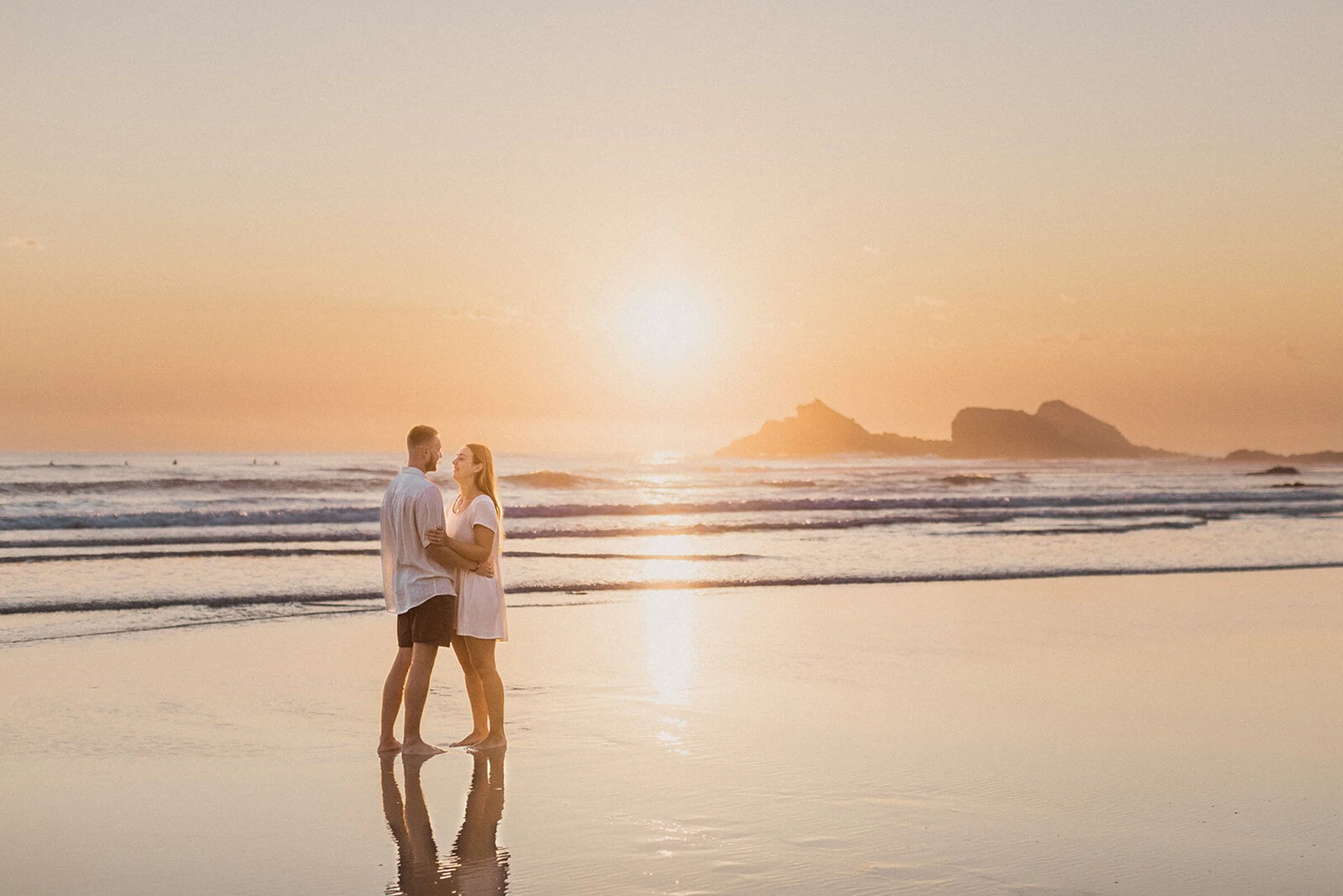 Couple embracing at sunrise on the beach near Broken Head, Byron Bay proposal photographyCouple embracing at sunrise on the beach near Broken Head, Byron Bay proposal photography/byron-bay-proposalElopement in the Byron Bay hinterland