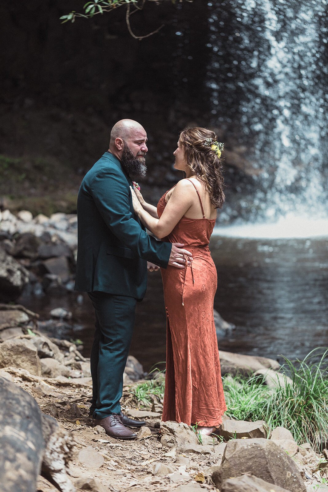 Groom holding the bride's face under the waterfall, Sara and Graeme's elopement at Killen Falls, Northern Rivers