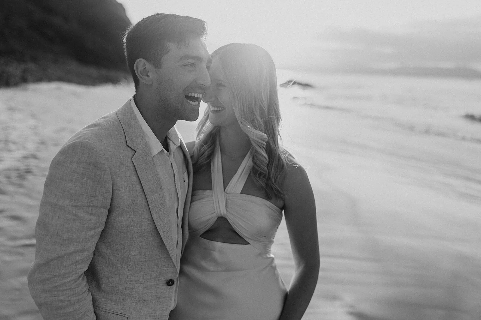 Black and white of the couple laughing cheek to cheek, Abby and James' elopement at Little Wategos Beach, Byron Bay