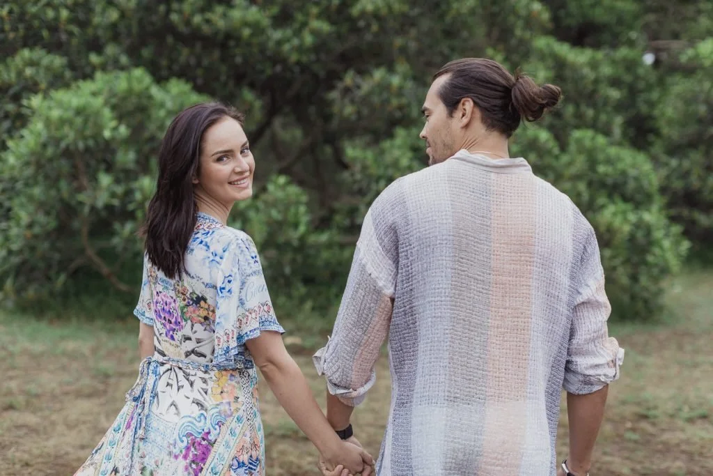 Pre-wedding photos in Centennial Park, Sydney – couple walking hand in hand