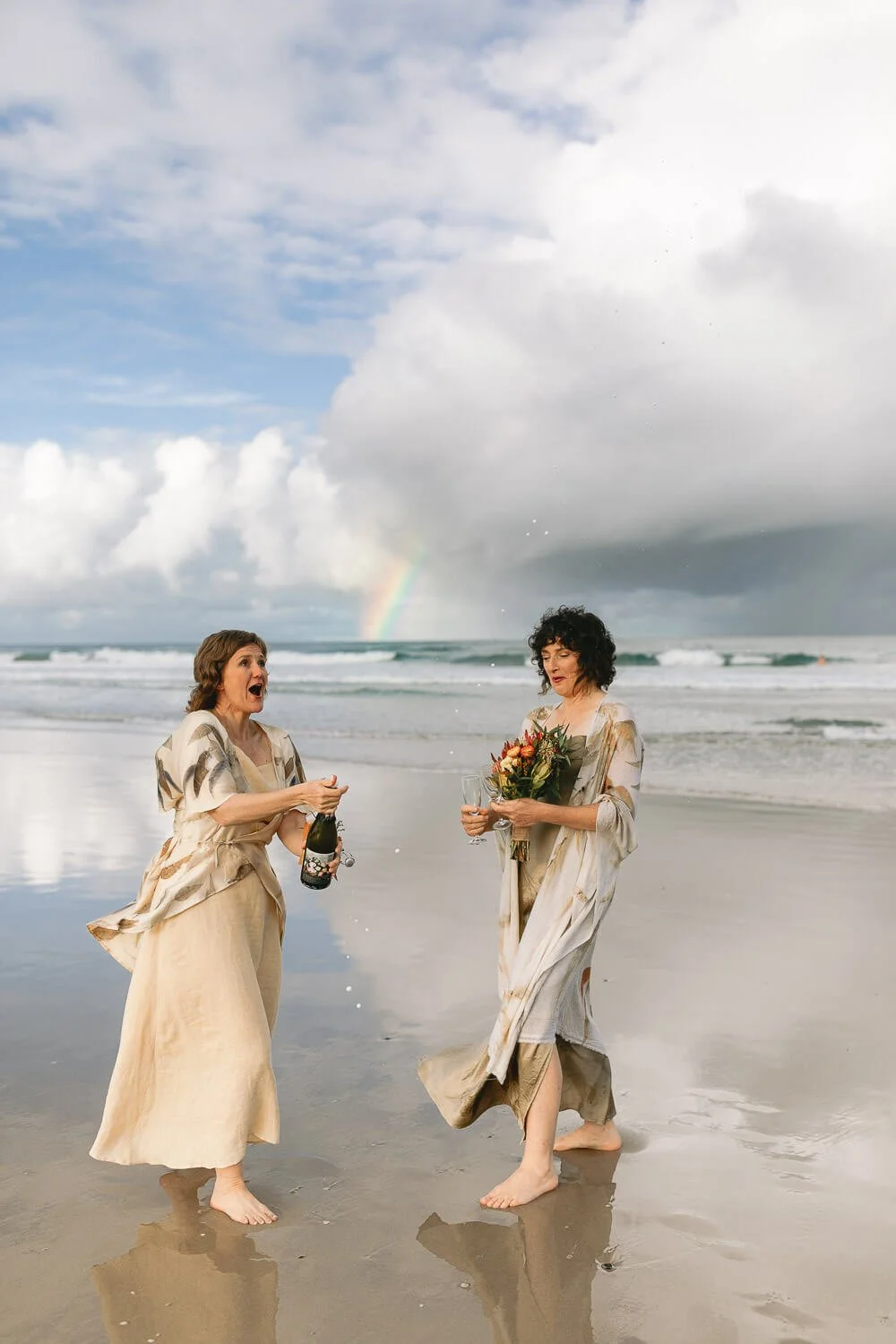 Two brides with their bouquets on Seven Mile Beach, Lennox Head
