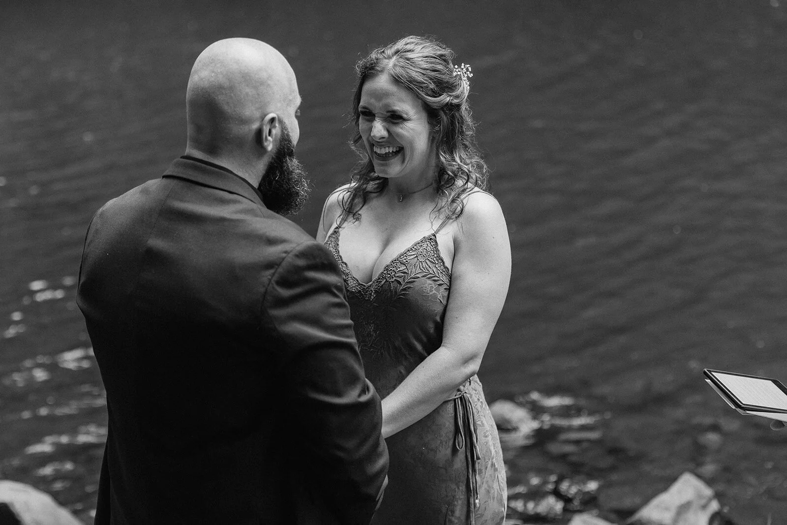 Black and white of the groom with a laughing bride, Sara and Graeme's elopement at Killen Falls, Northern Rivers