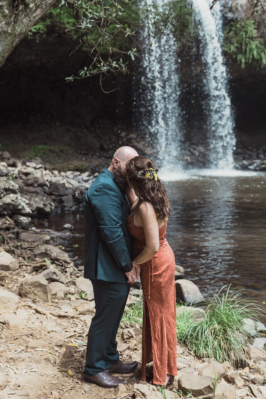 Couple kissing at the base of Killen Falls, Sara and Graeme's elopement, Northern Rivers