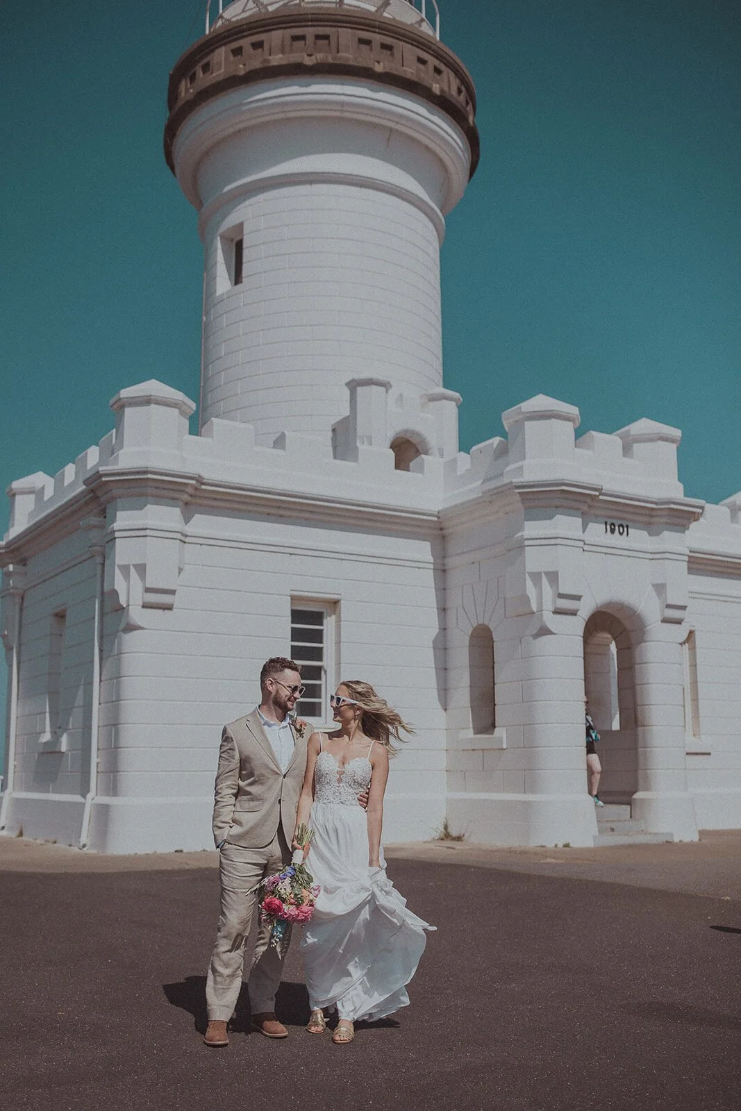 Couple in front of Cape Byron Lighthouse, Eliza and Greg's elopement at Broken Head, Byron Bay