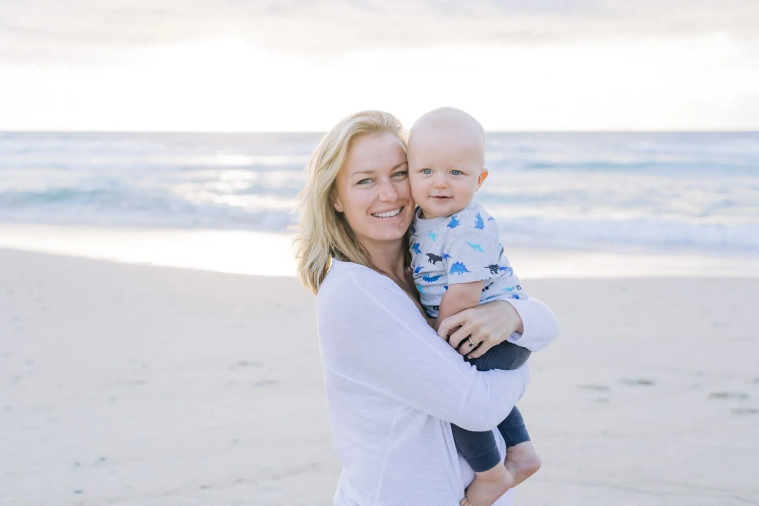 Mother and baby at sunrise on Bondi Beach