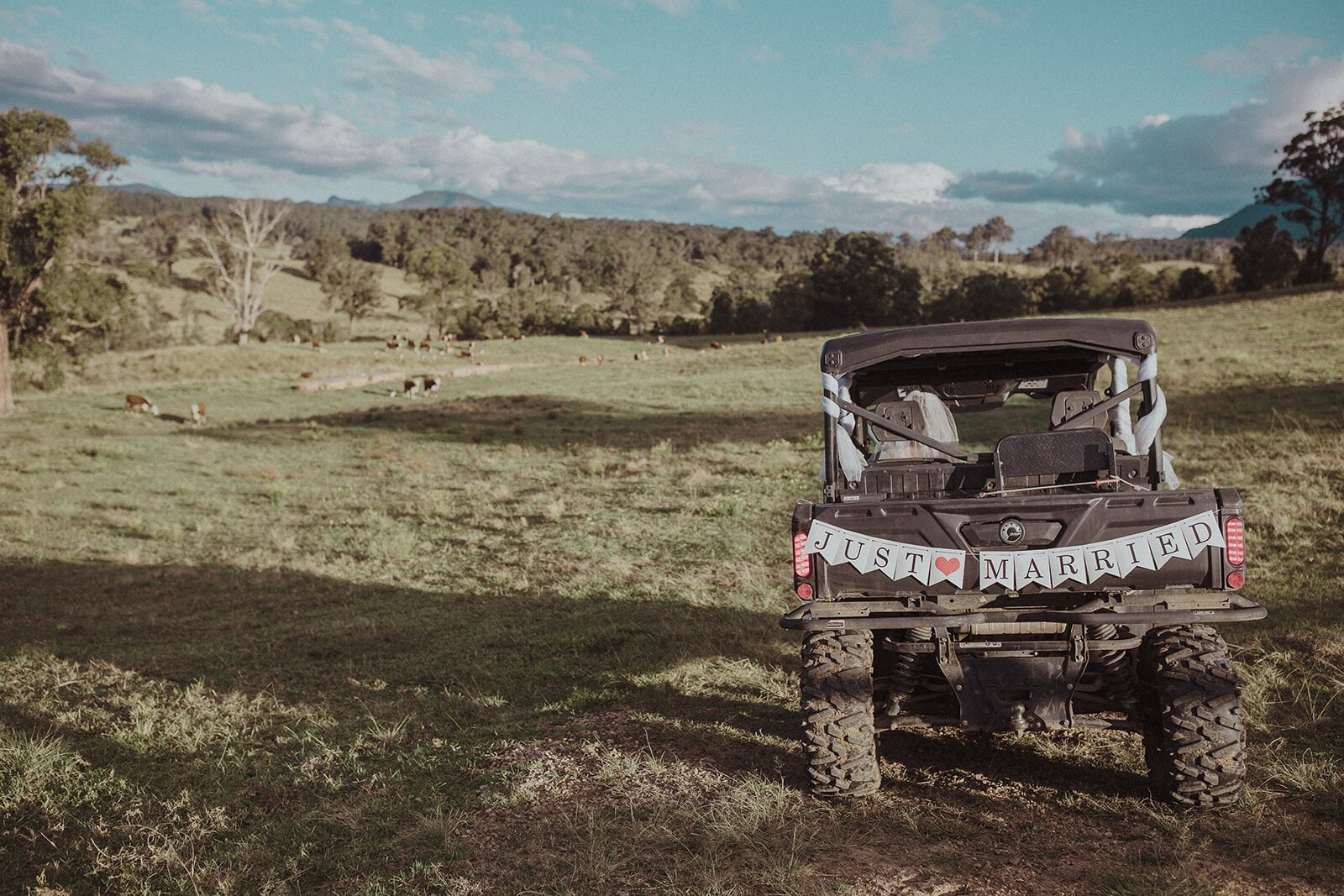 Just Married sign on a farm buggy in the paddock, Sam and Tom's elopement at Highfield Farm, Northern Rivers