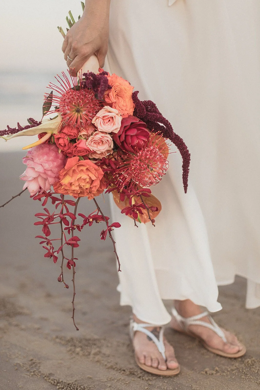 Detail of the bright bouquet and the bride's sandals, Maritess and Mark's elopement at Lennox Head