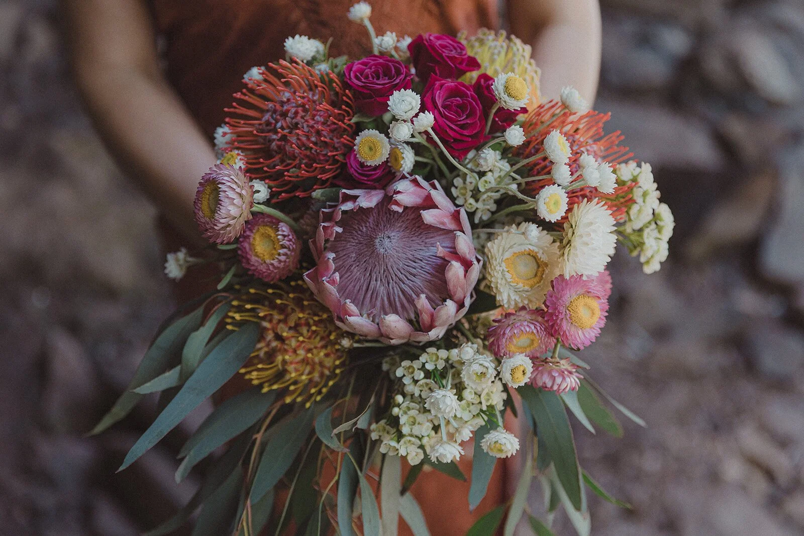 Detail of the protea and wildflower bouquet, Sara and Graeme's elopement at Killen Falls, Northern Rivers