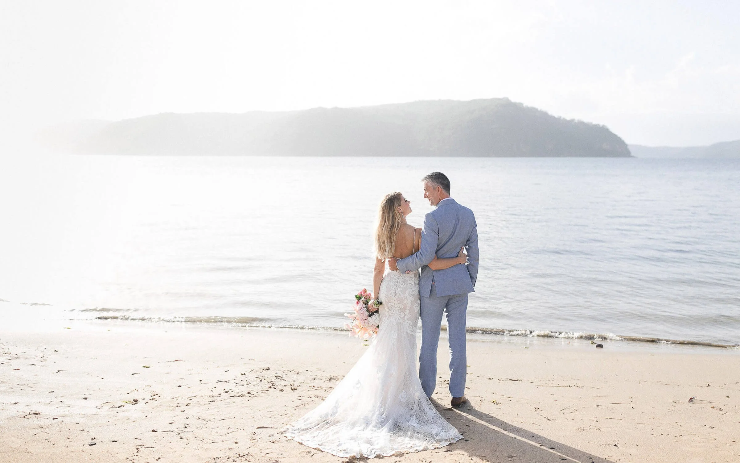 Bride and groom on the sand at Palm Beach, Sydney’s Northern Beaches