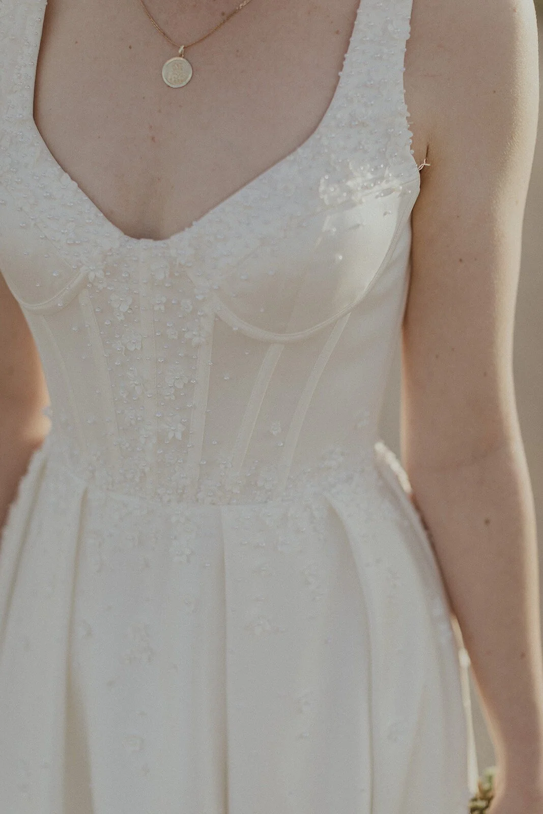 Detail of the bride's dress bodice and necklace, Sam and Tom's elopement at Highfield Farm, Northern Rivers