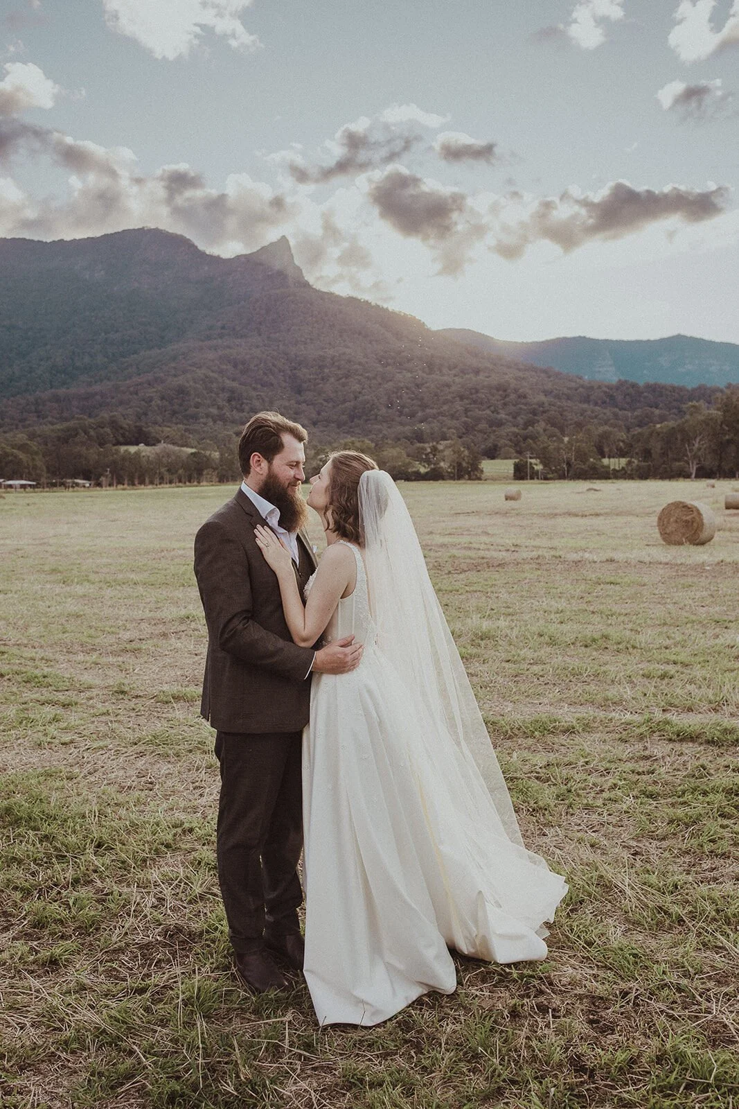 Couple holding each other in the paddock, Sam and Tom's elopement at Highfield Farm, Northern Rivers