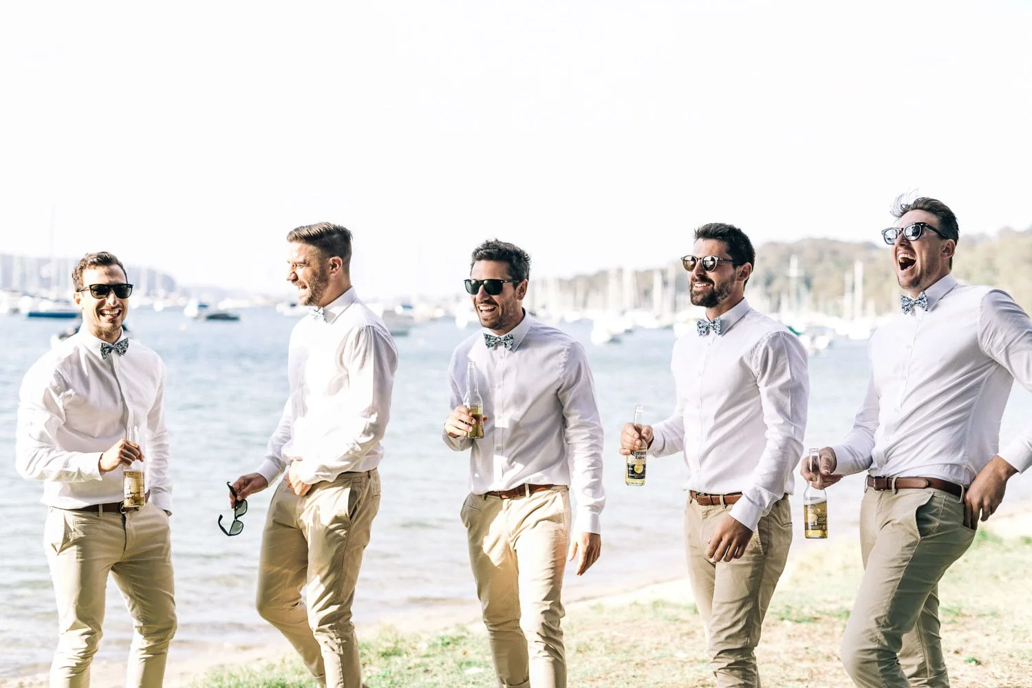 Groomsmen standing on the sand at Bilgola Beach