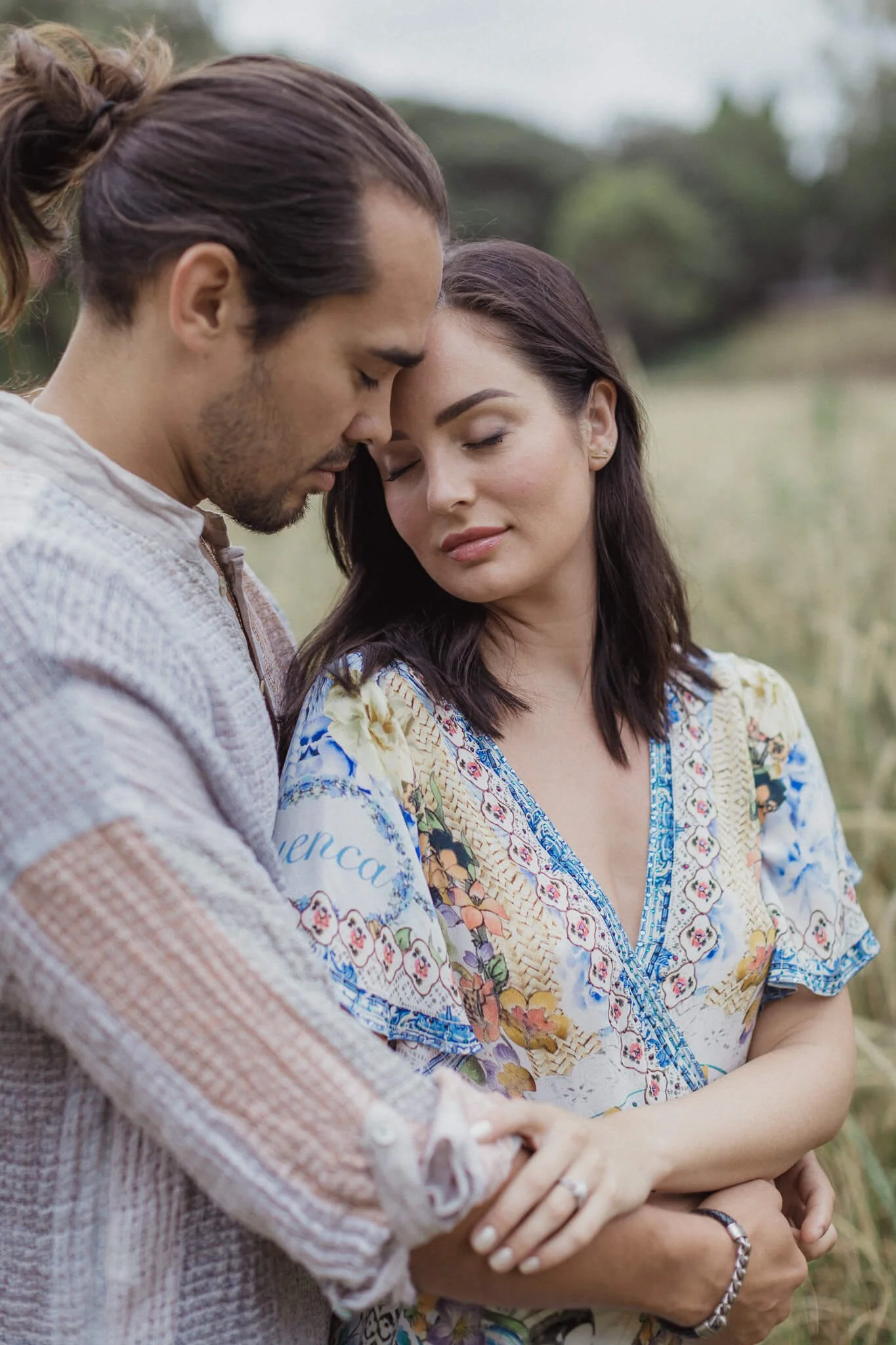 Couple resting foreheads together during their Centennial Park pre-wedding shoot