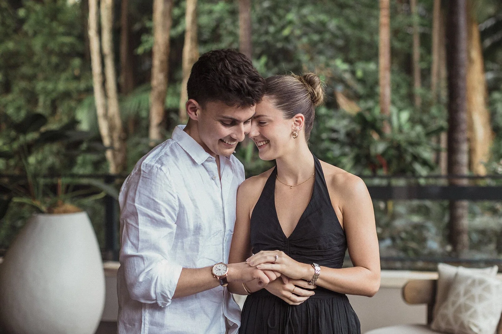 Couple laughing together as they show the ring, Ben and Chloe's marriage proposal in Byron Bay