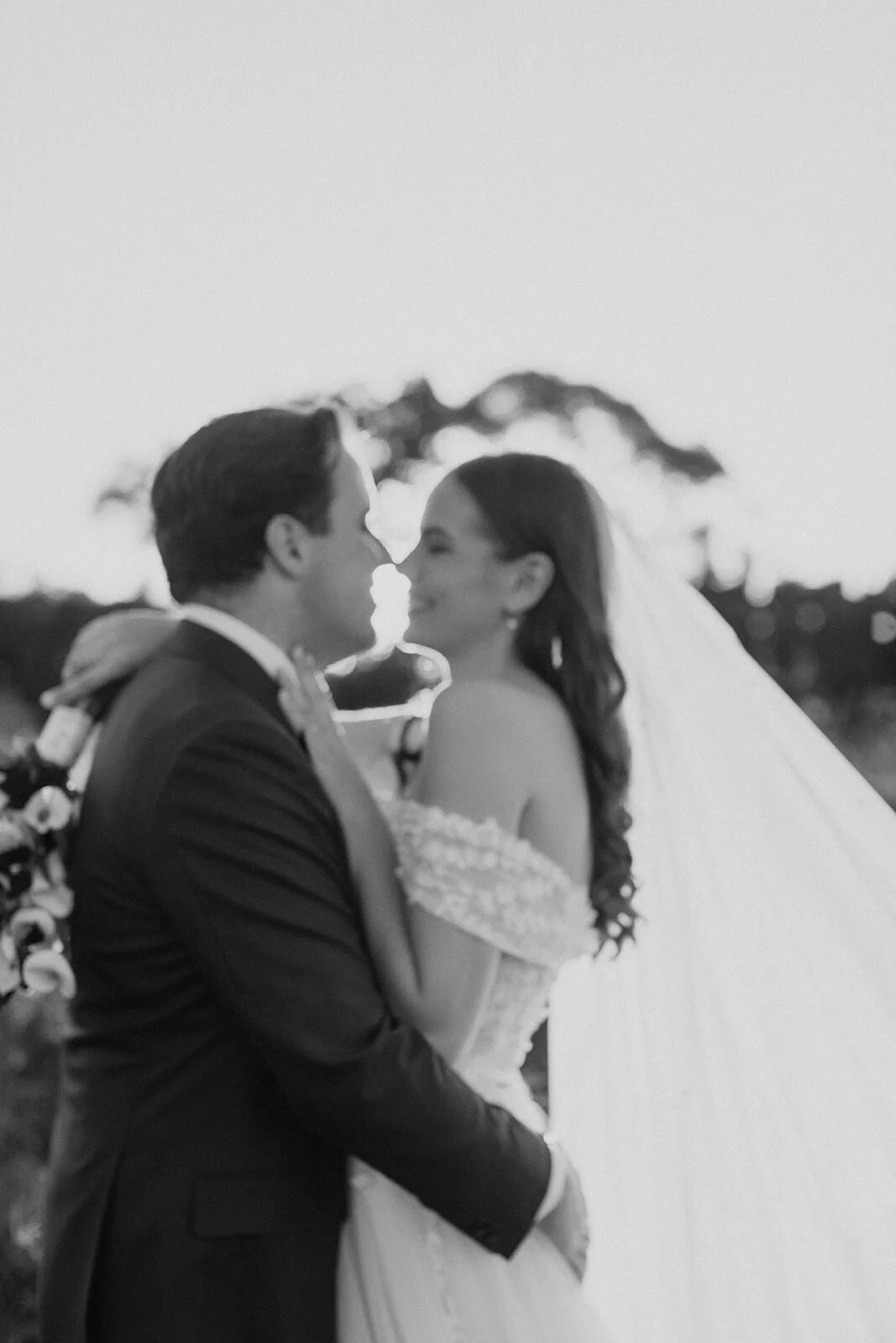 Black and white of the couple about to kiss, Steph and William's wedding at Earth House, Byron Bay
