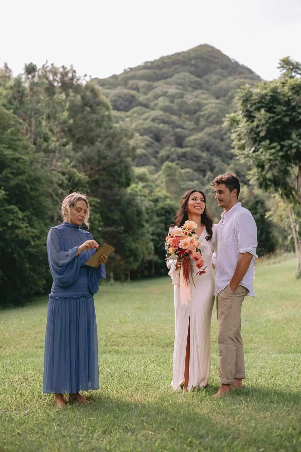 Celebrant leading a weekday elopement ceremony beneath Mount Chincogan, near Mullumbimby