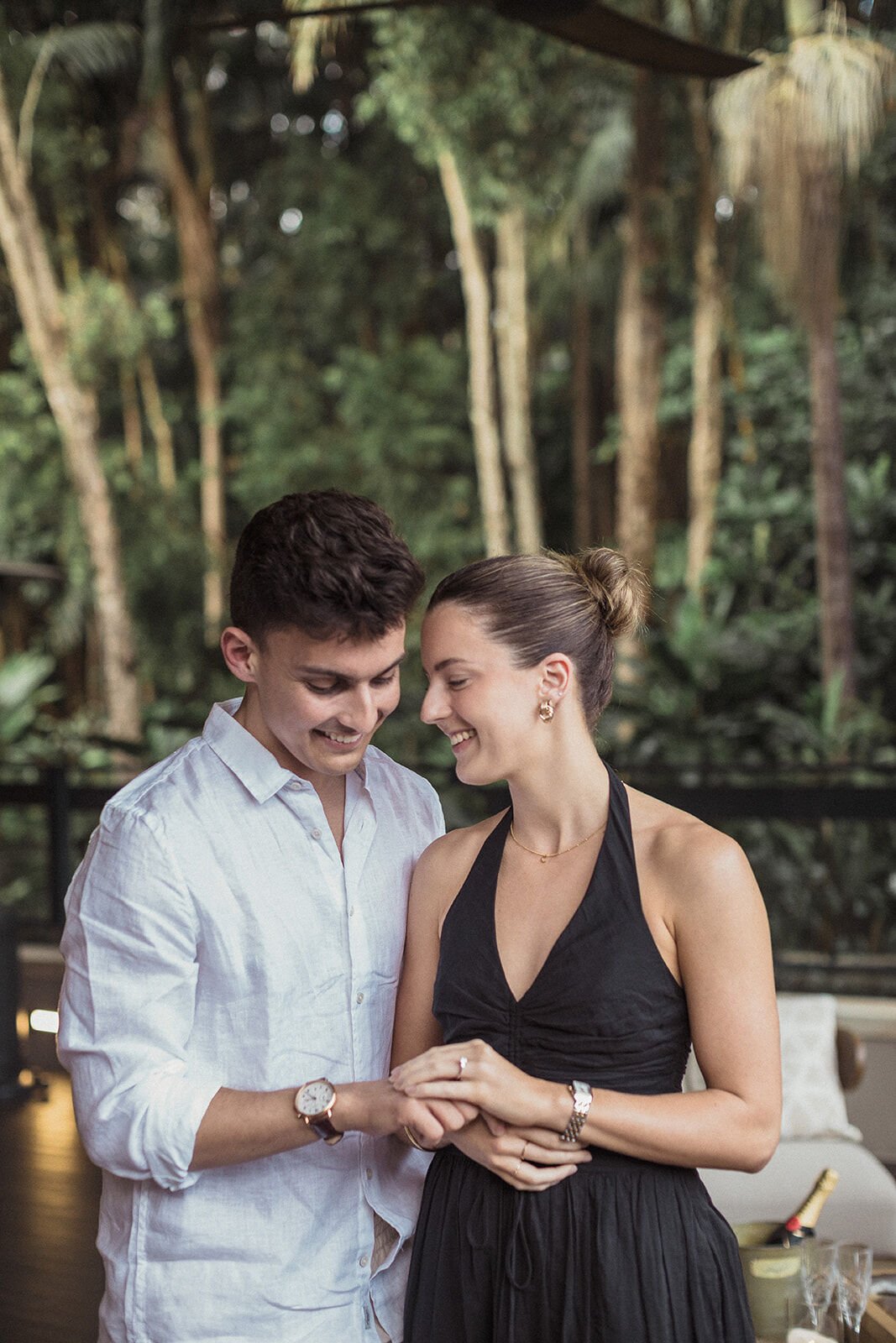 Couple with foreheads together admiring the ring, Ben and Chloe's marriage proposal in Byron Bay