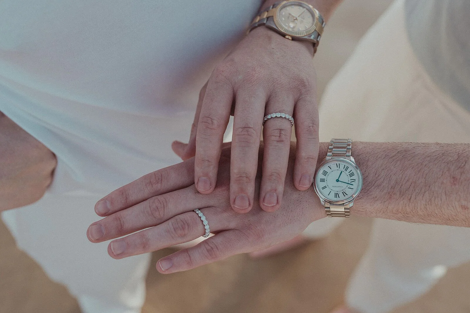Close up of the couple's hands with their rings, Byron and Luke's marriage proposal at Cabarita Beach, Northern Rivers