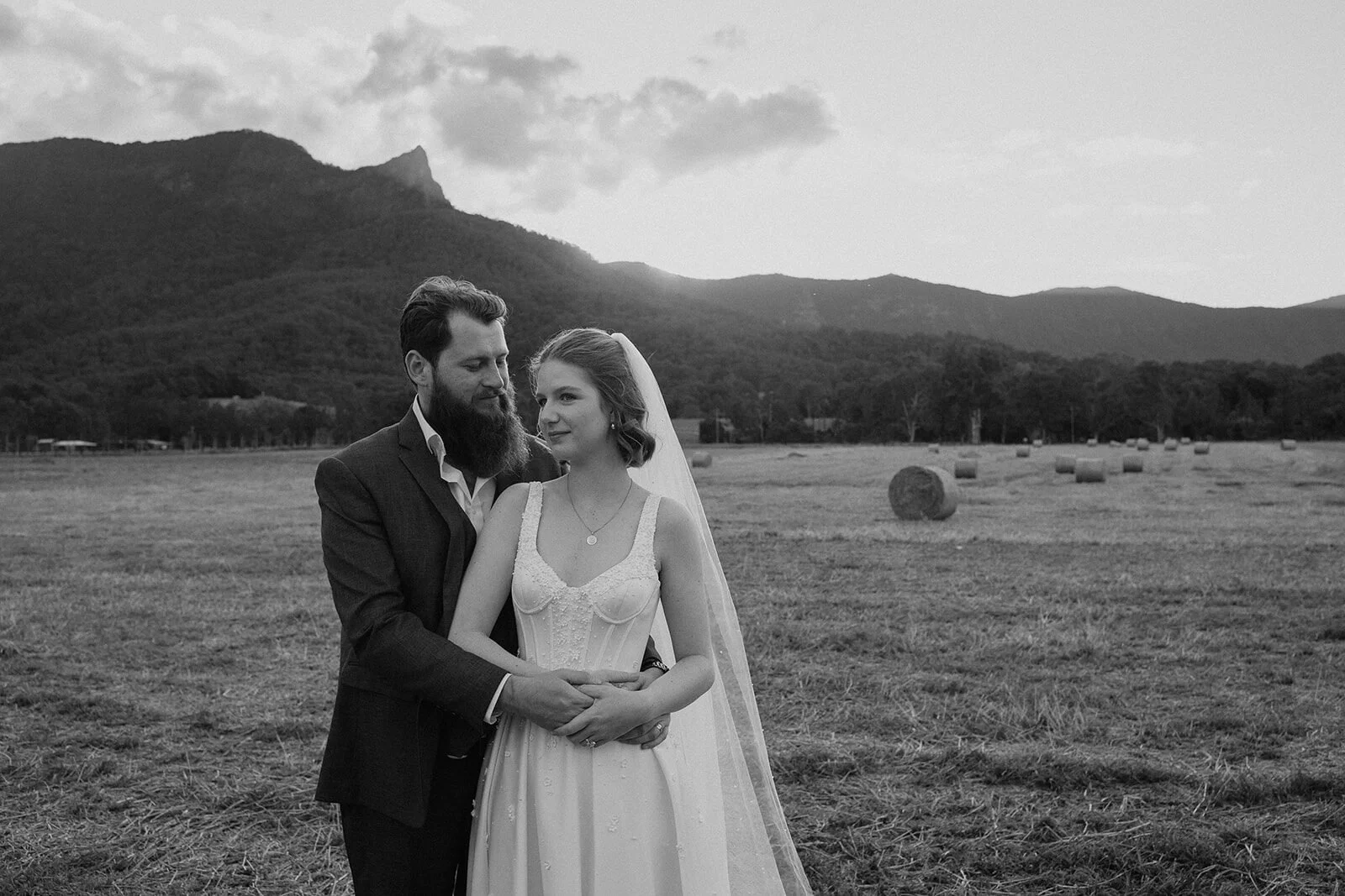 Black and white of the couple in the field, Sam and Tom's elopement at Highfield Farm, Northern Rivers