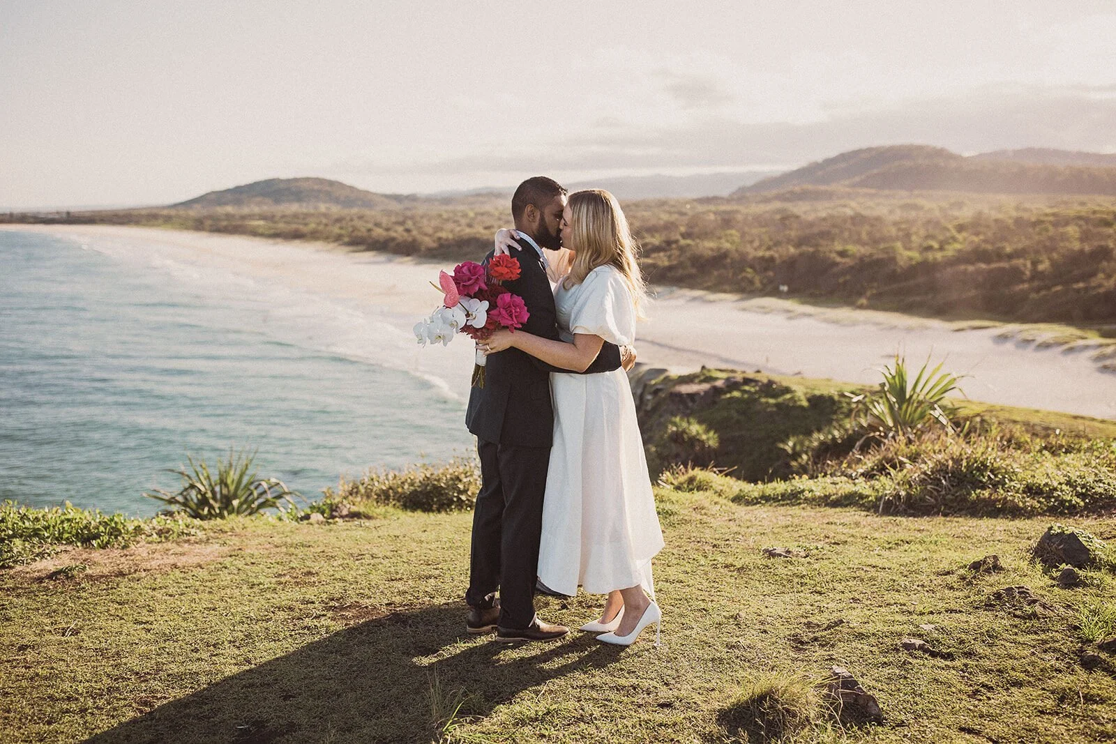 Couple kissing on the headland above Cabarita Beach, Brittany and Mark's elopement at Cabarita Beach, Northern Rivers