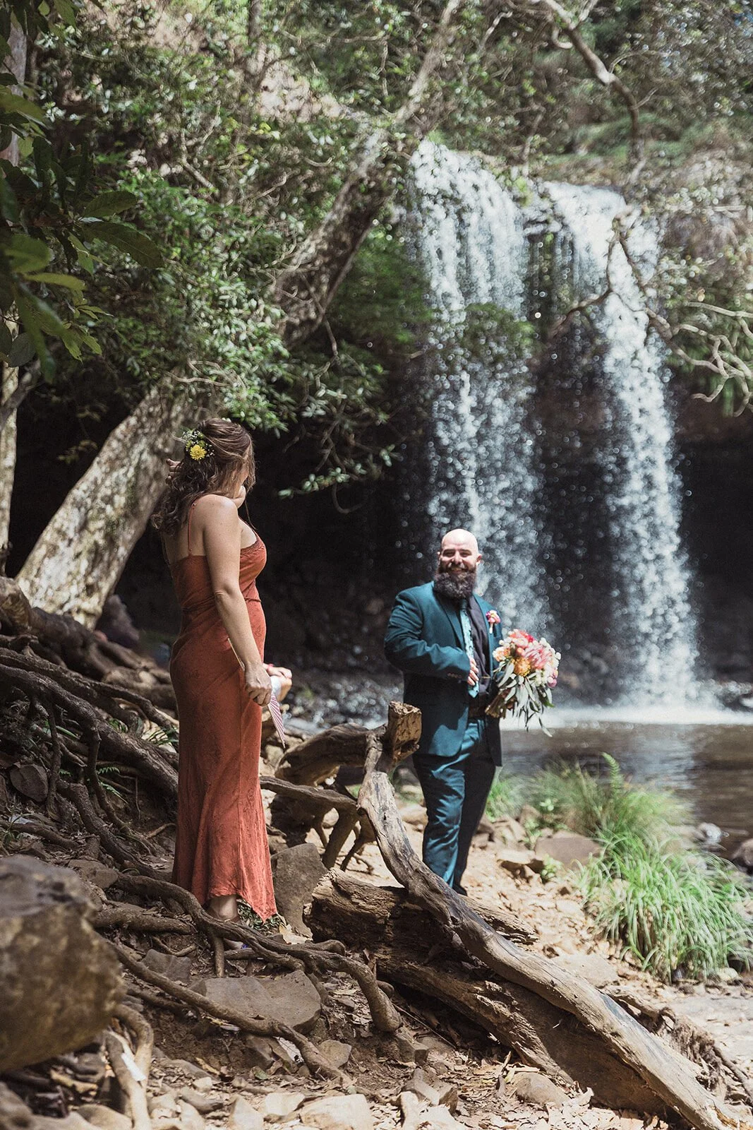 Bride and groom facing each other beside Killen Falls, Sara and Graeme's waterfall elopement, Northern Rivers