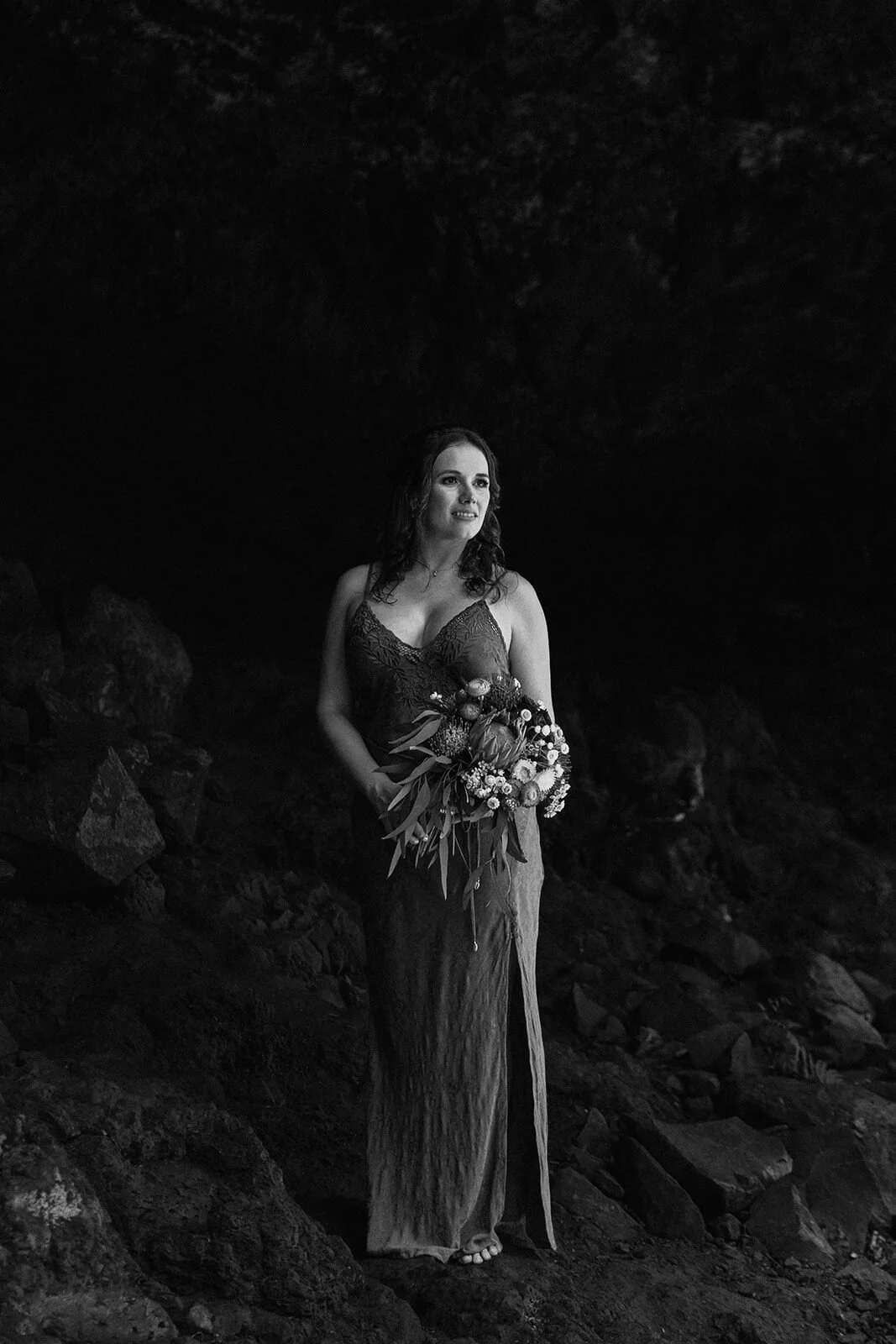 Black and white portrait of the bride with her bouquet, Sara and Graeme's elopement at Killen Falls, Northern Rivers