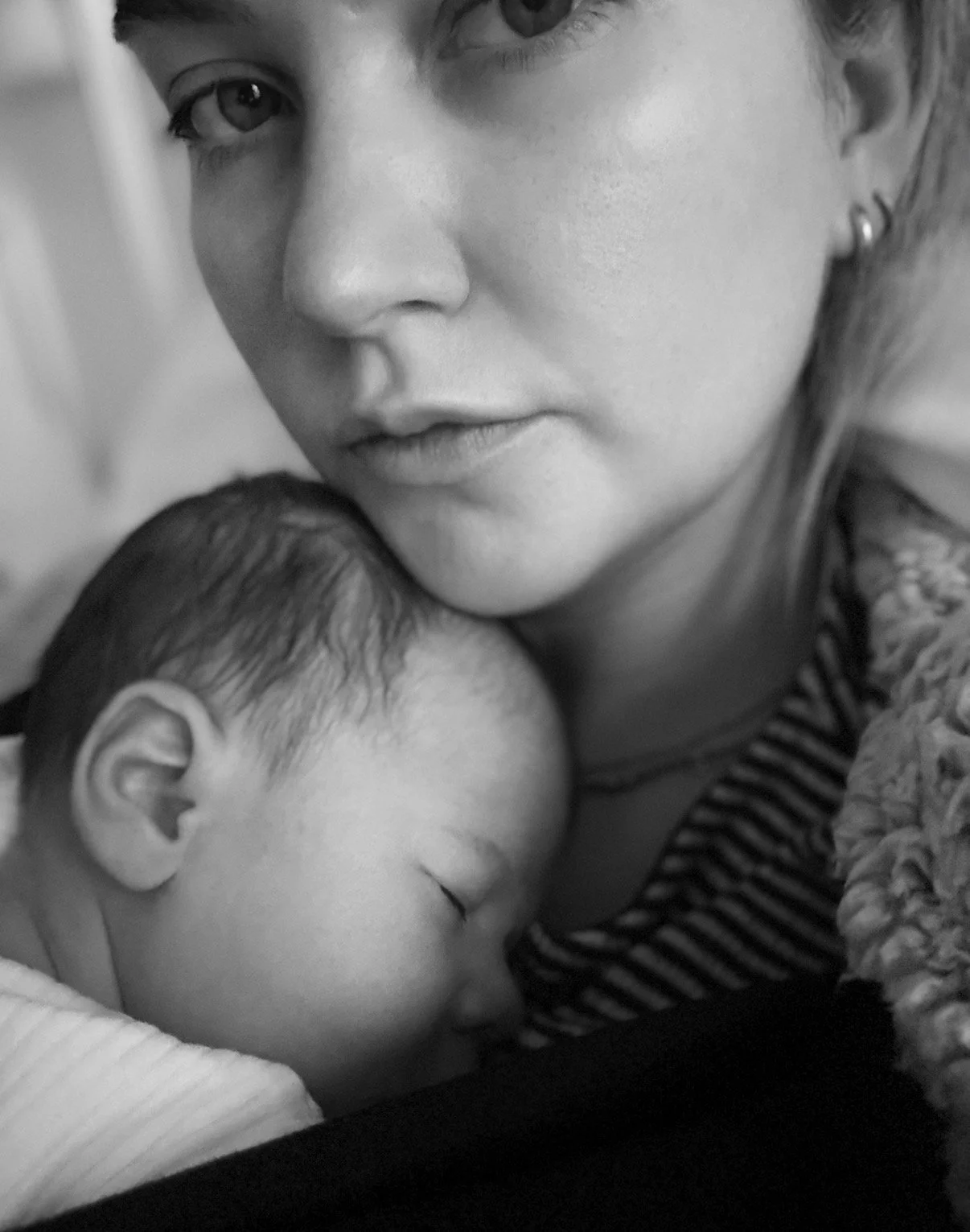 AM Skin House founder holding her baby