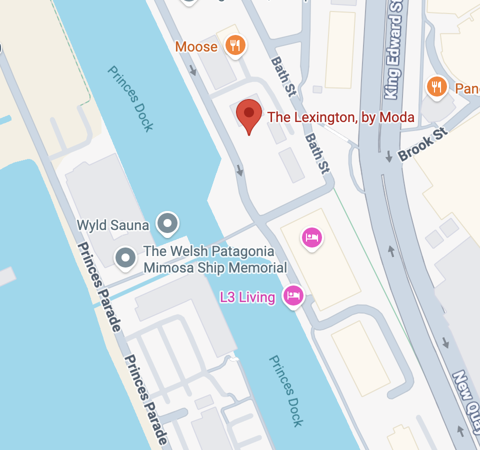 A map showing The Lexington, by Moda on Bath Street near Princes Dock, with nearby locations including Wyld Sauna, The Welsh Patagonia Mimosa Ship Memorial, L3 Living, and restaurants Moose and Panera Bread, along with Prince's Parade and New Quay streets.
