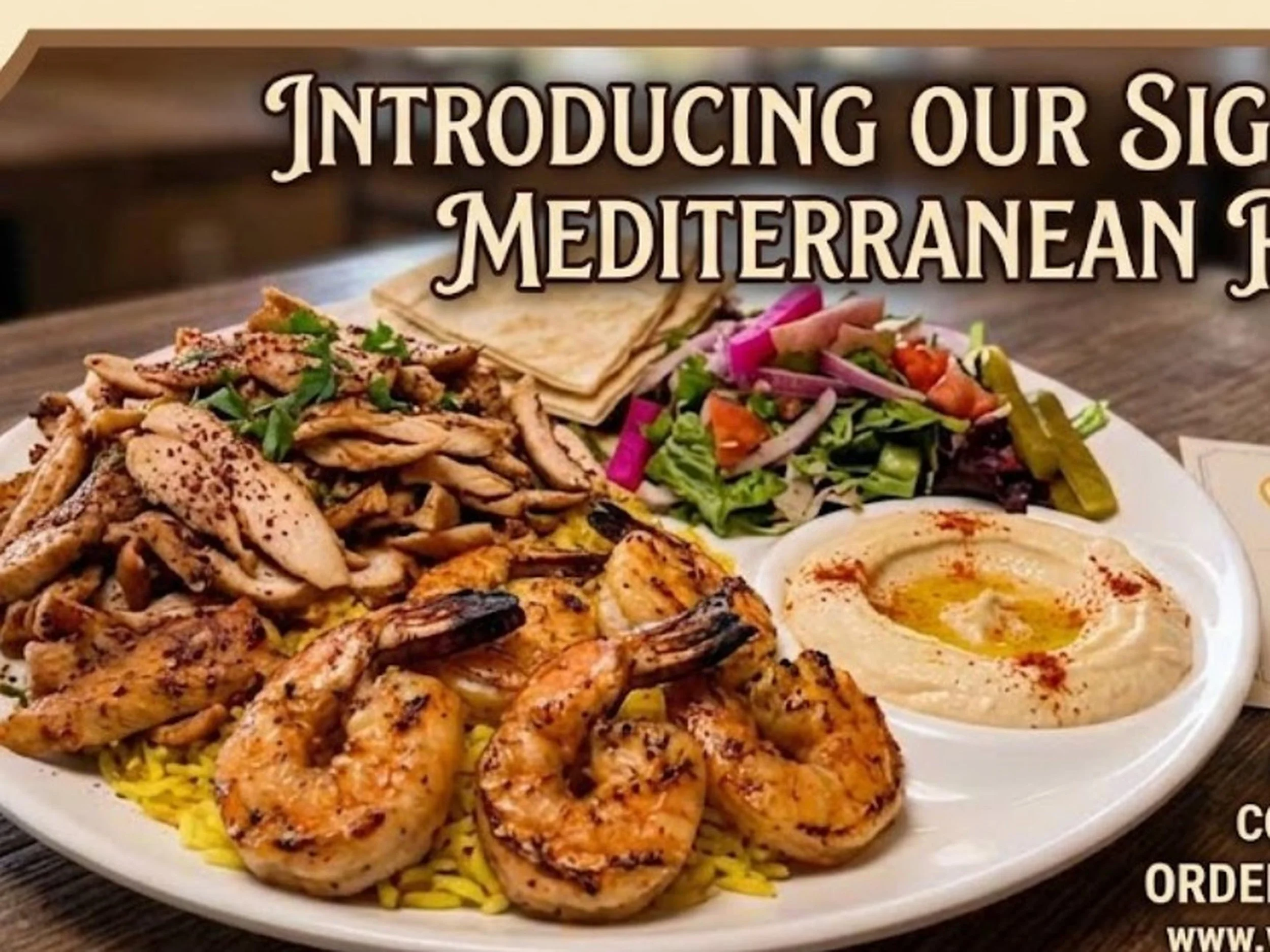A large plate of Mediterranean food, including grilled chicken, pita bread, a salad with vegetables, and hummus with oil and paprika.