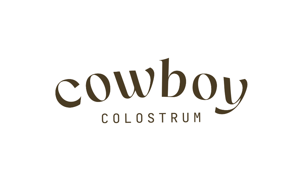 Logo for Cowboy Colostrum with the word 'cowboy' in large, stylized font and 'colostrum' in smaller, uppercase letters beneath it.