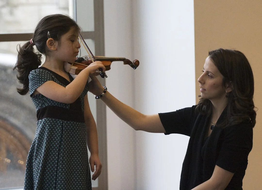 Teacher assisting a student