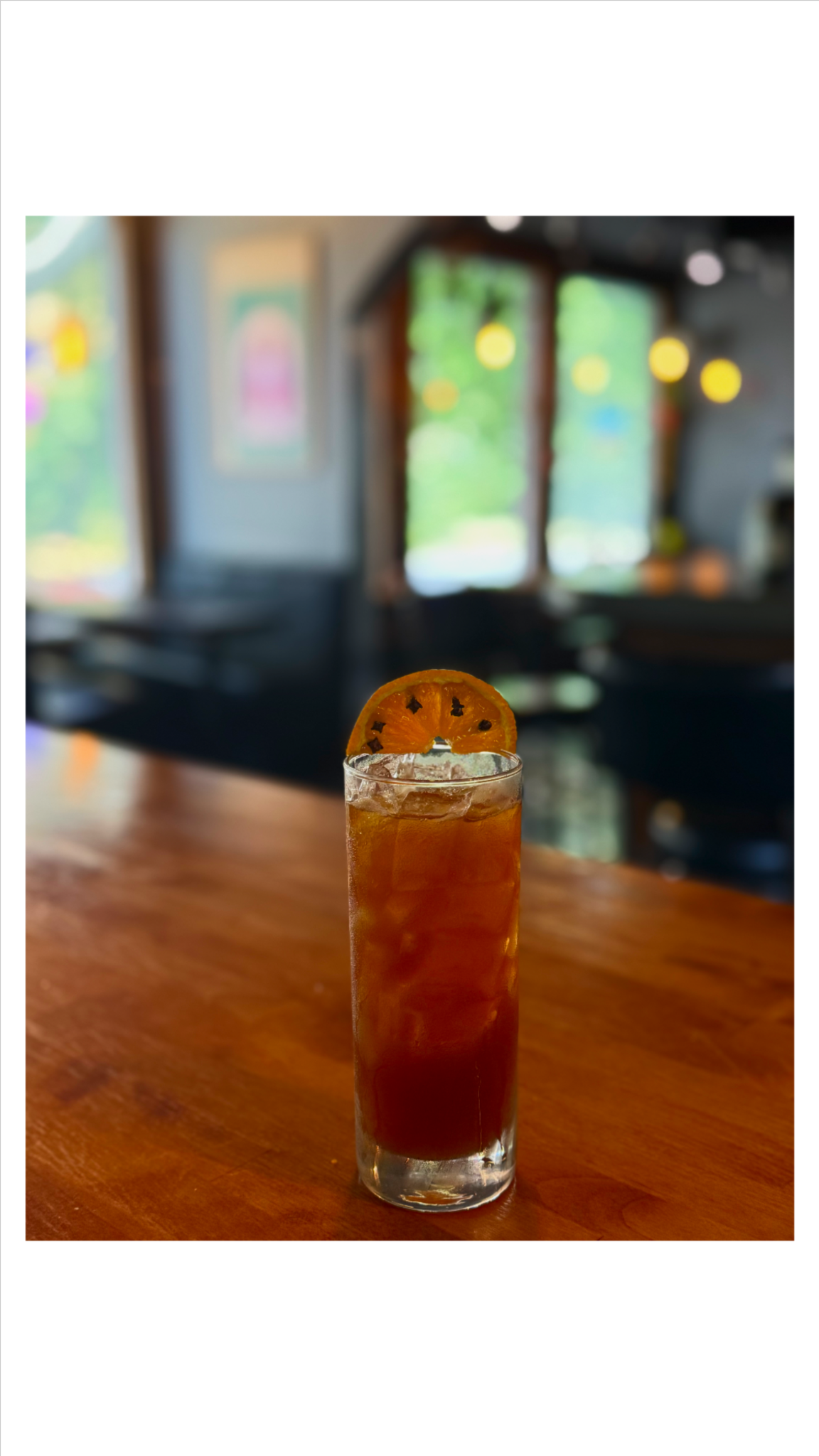 A tall red craft cocktail at Northside Social