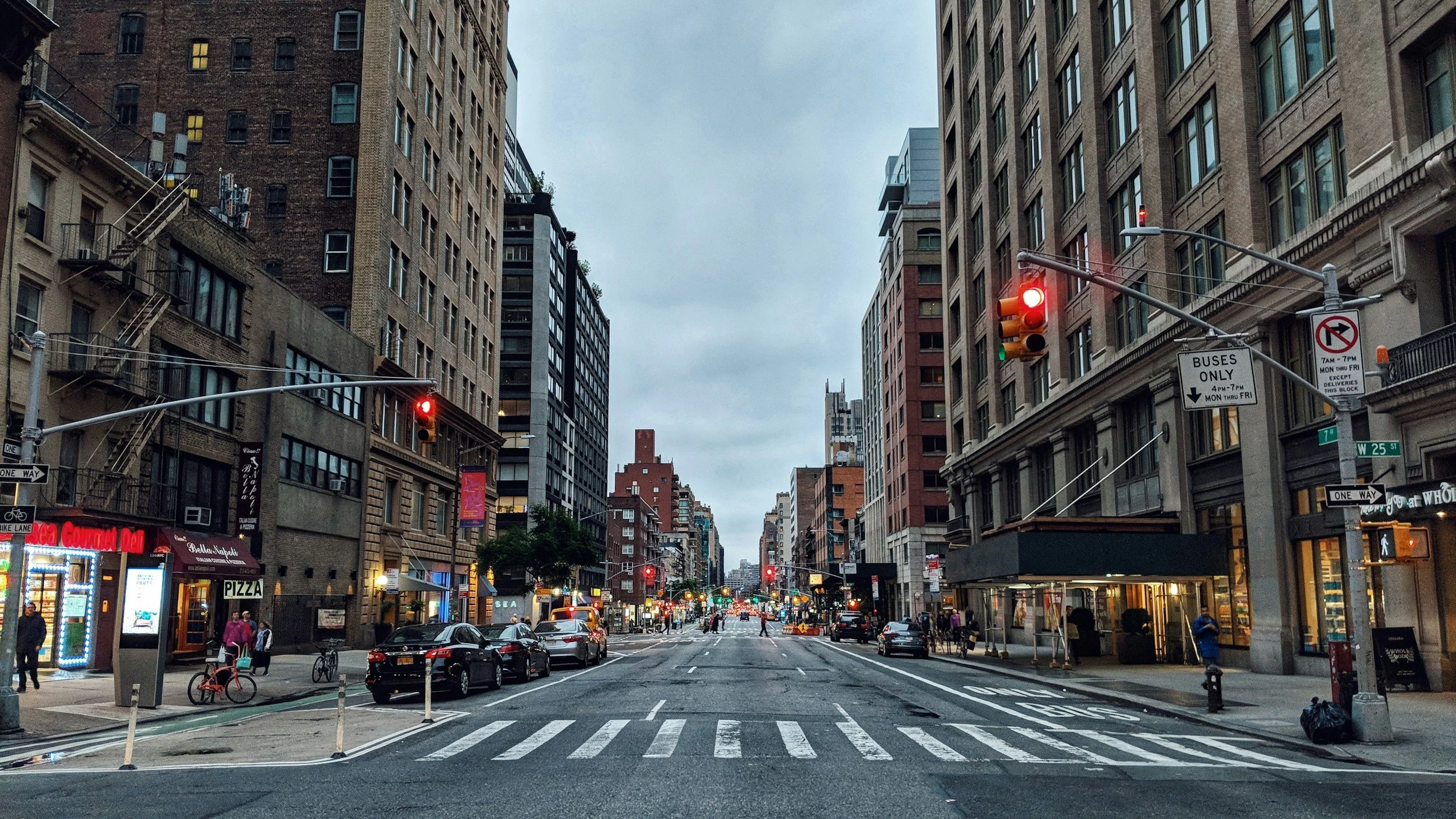 Manhattan street lined with older commercial buildings