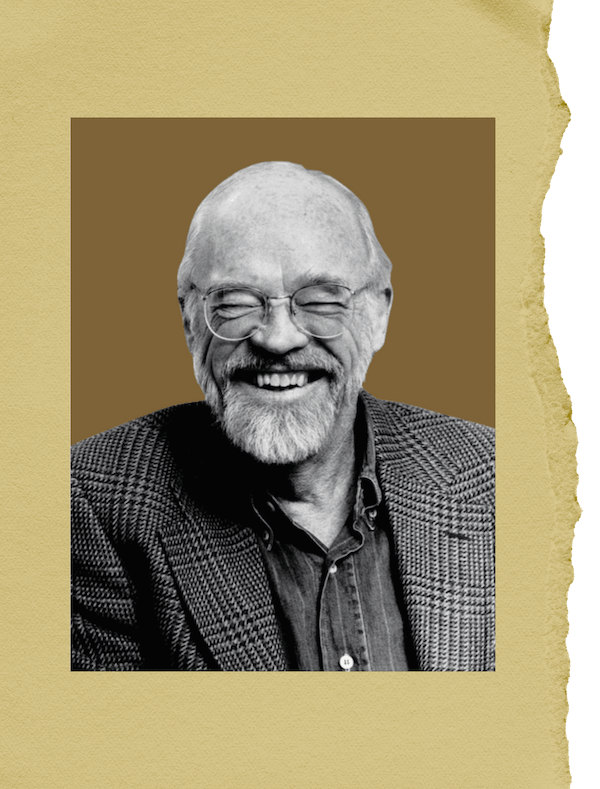 Black-and-white portrait of a smiling older man with glasses, a beard, and a checkered blazer, on a beige background.