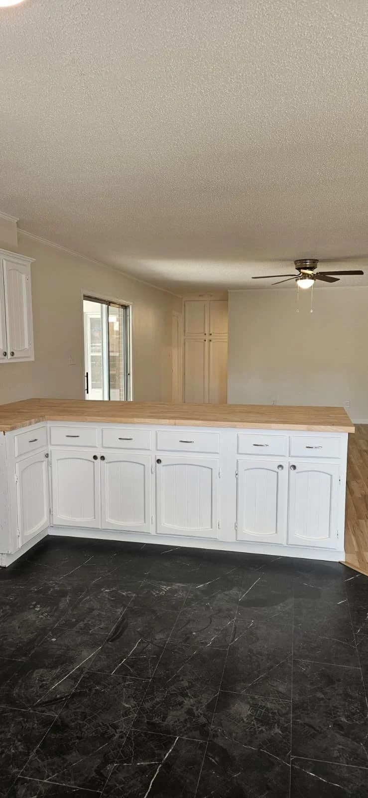 Kitchen Island base painted white in Gadsden, Alabama.