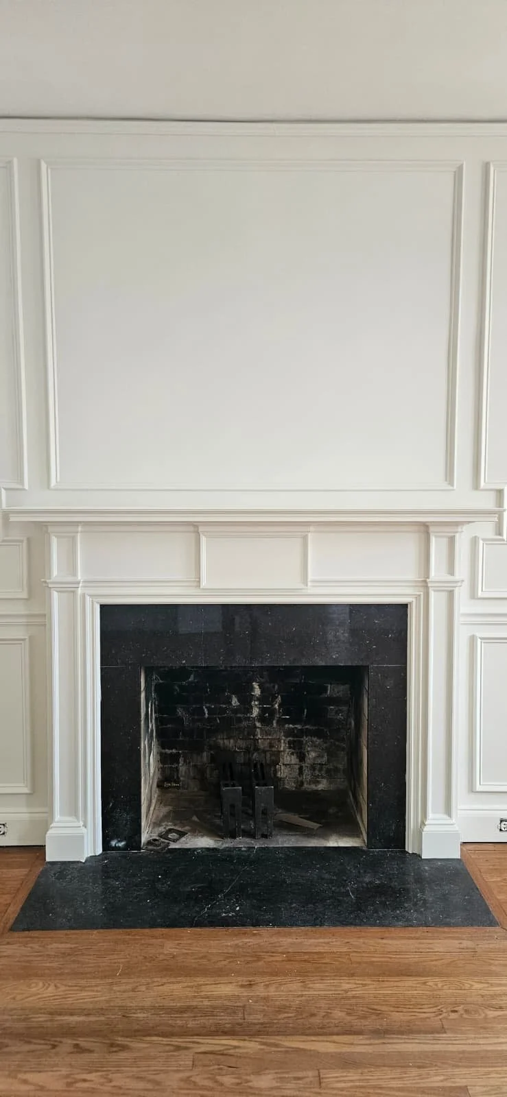 The fireplace, trim, and walls were painted during this project in Union Grove, Alabama.