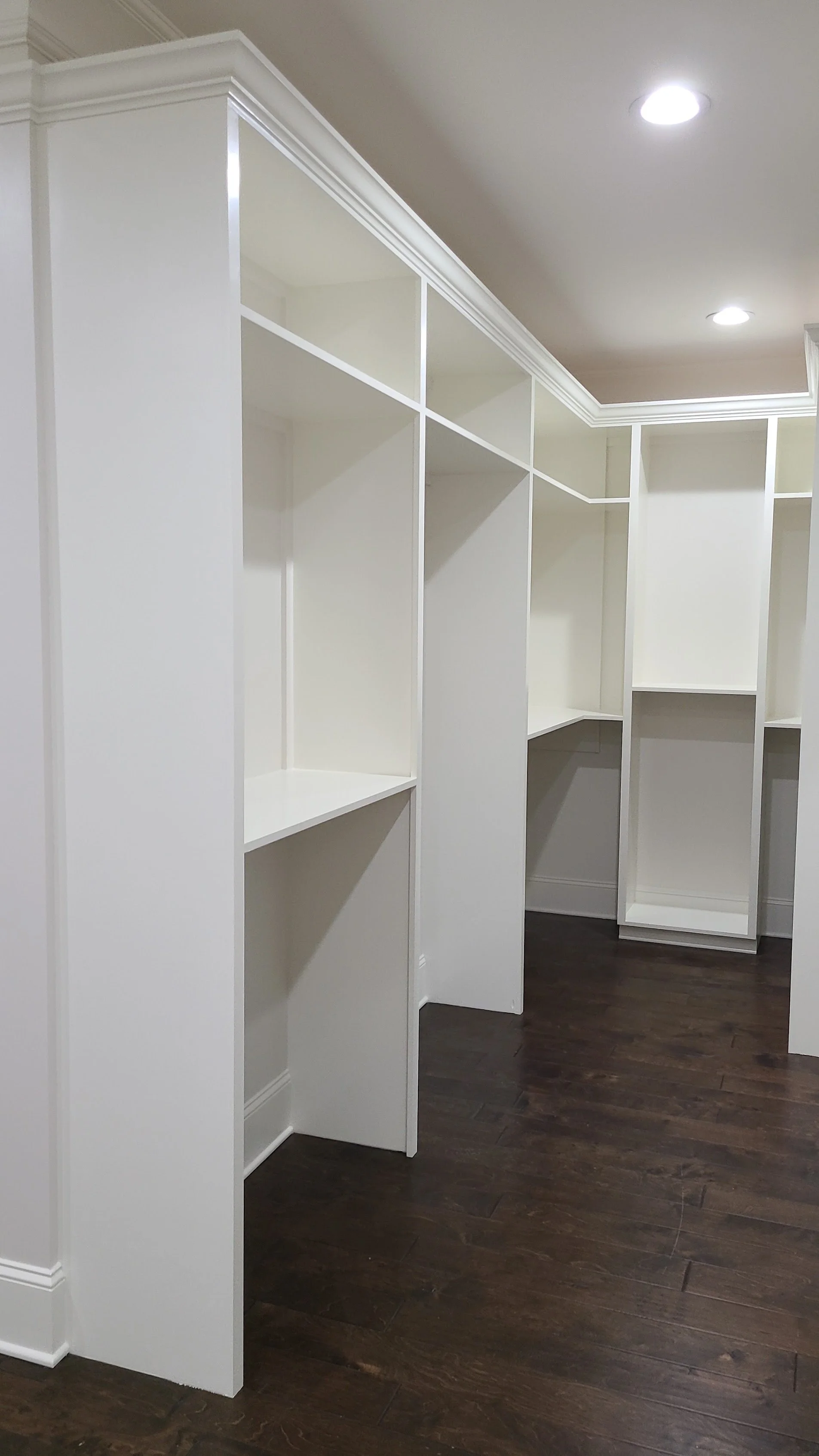 Closet System Shelves painted white in Guntersville, Alabama.