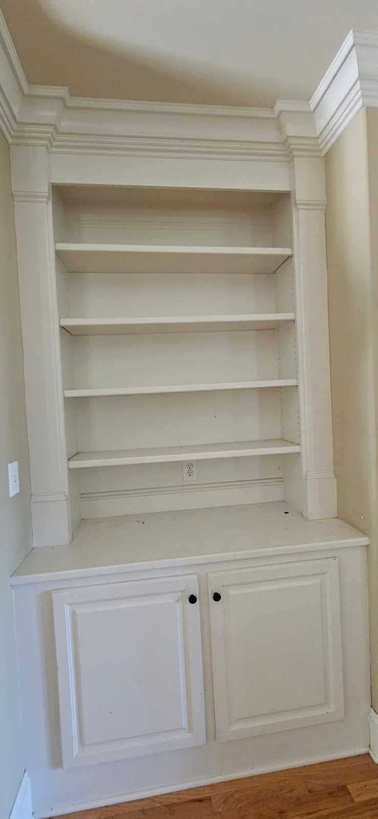 Built-In Shelves and Cabinet painted white in Huntsville, Alabama.