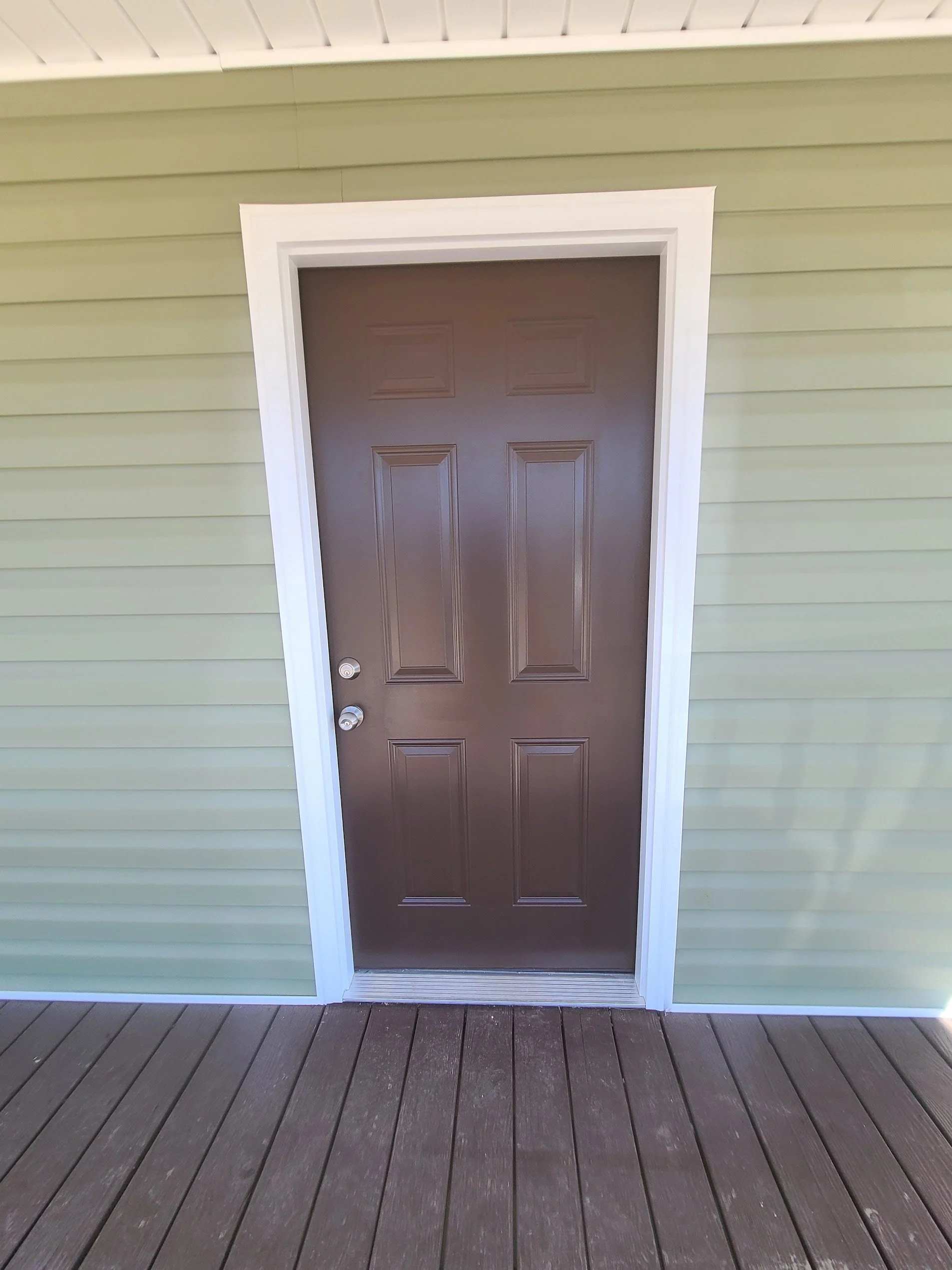 Freshly painted brown exterior door in Boaz, Alabama.