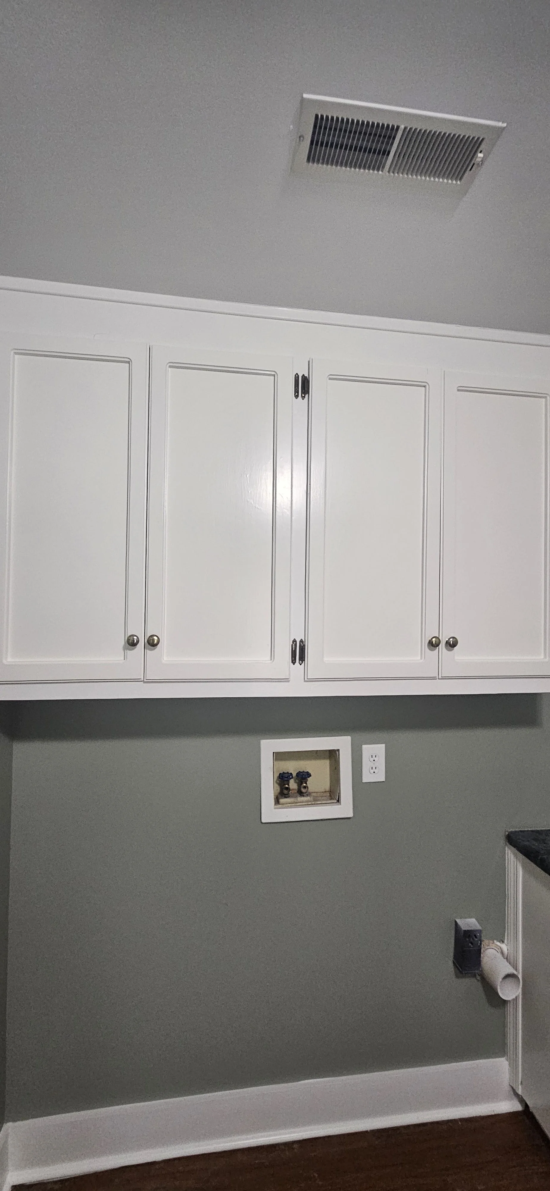After: Landry Room Cabinets with a bright new look in Huntsville, Alabama.