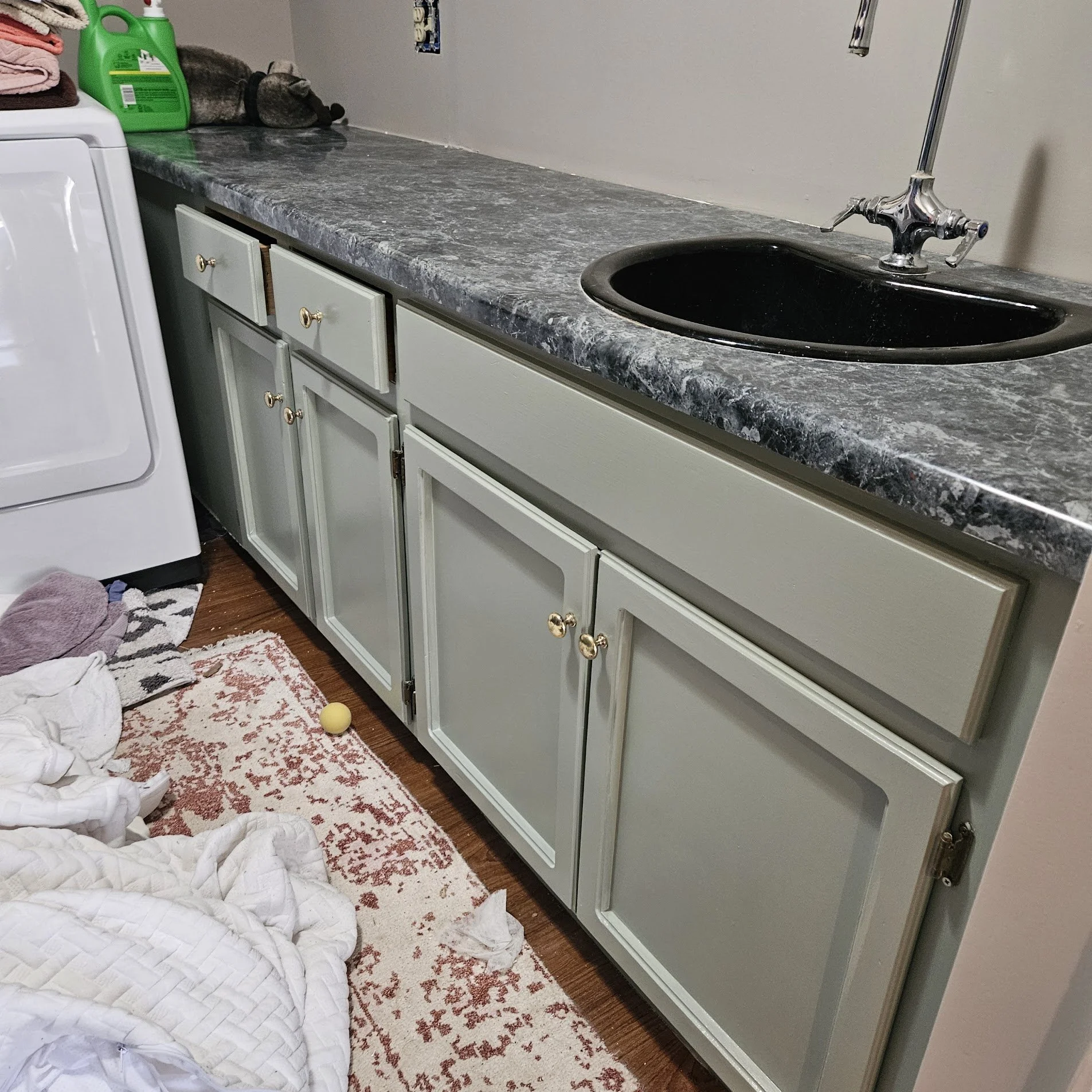 Before: Landry Room Cabinets needing a bright new look in Huntsville, Alabama.