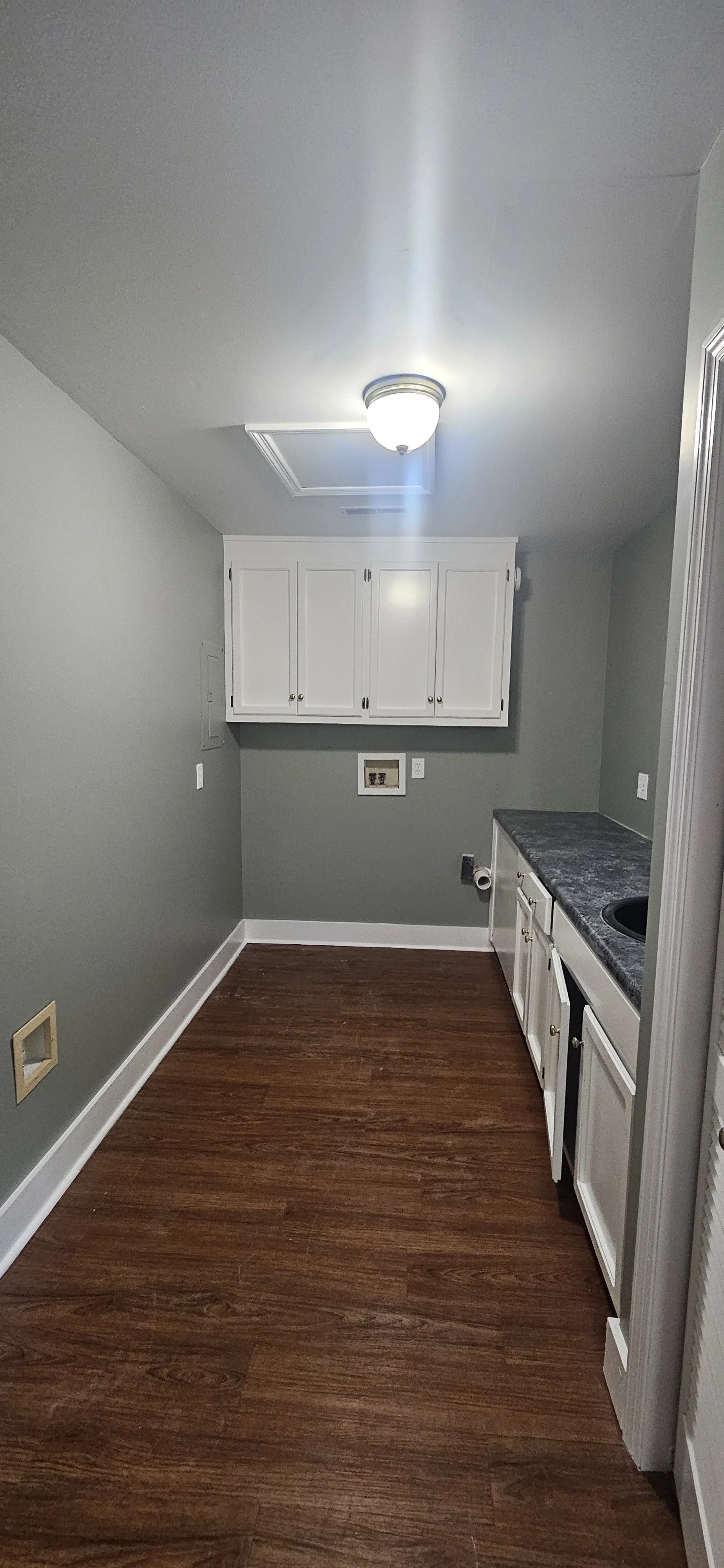 After: Landry Room Cabinets with a bright new look in Huntsville, Alabama.