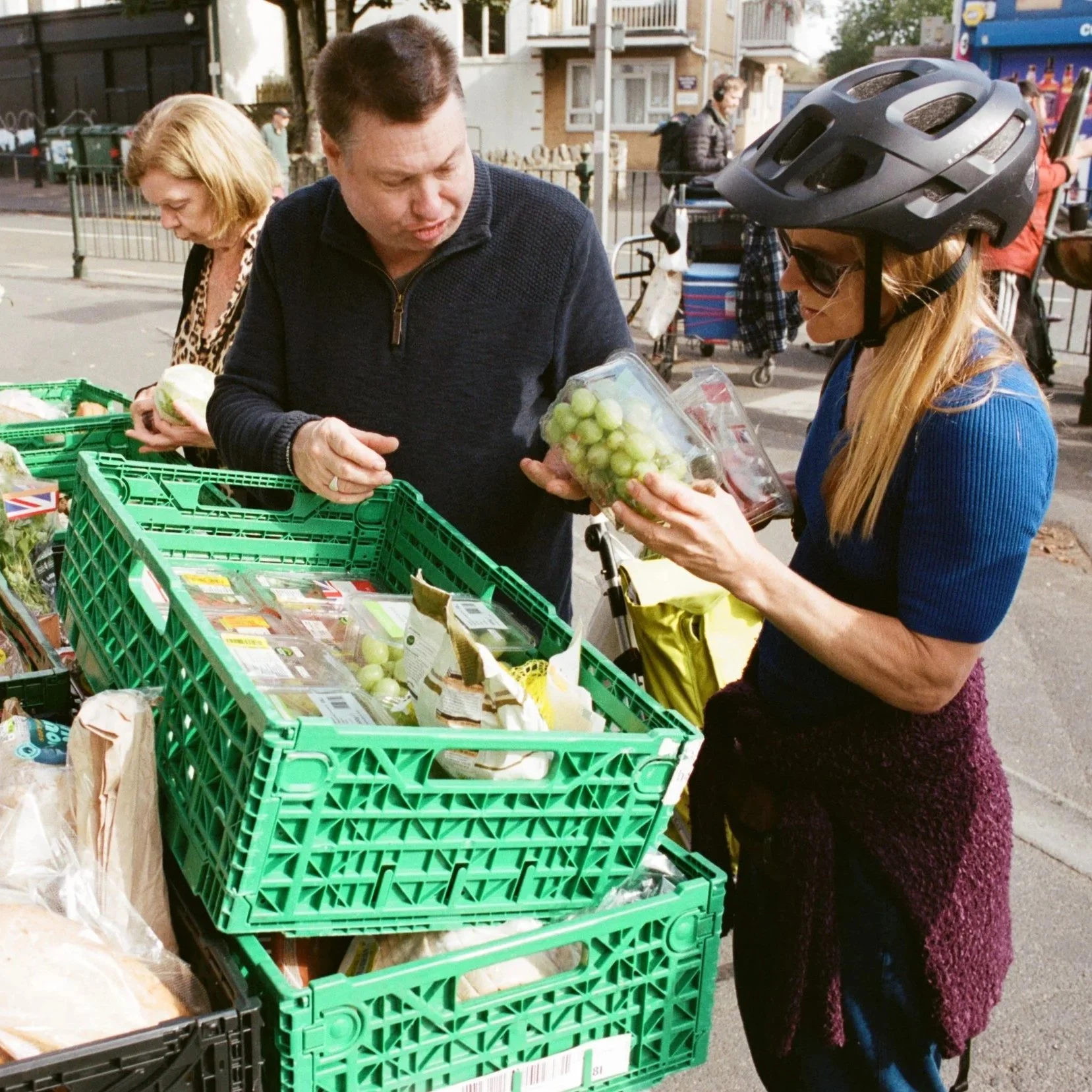 Volunteers sorting through clothing donations and essential supplies for the homeless at the Bournemouth charity base.